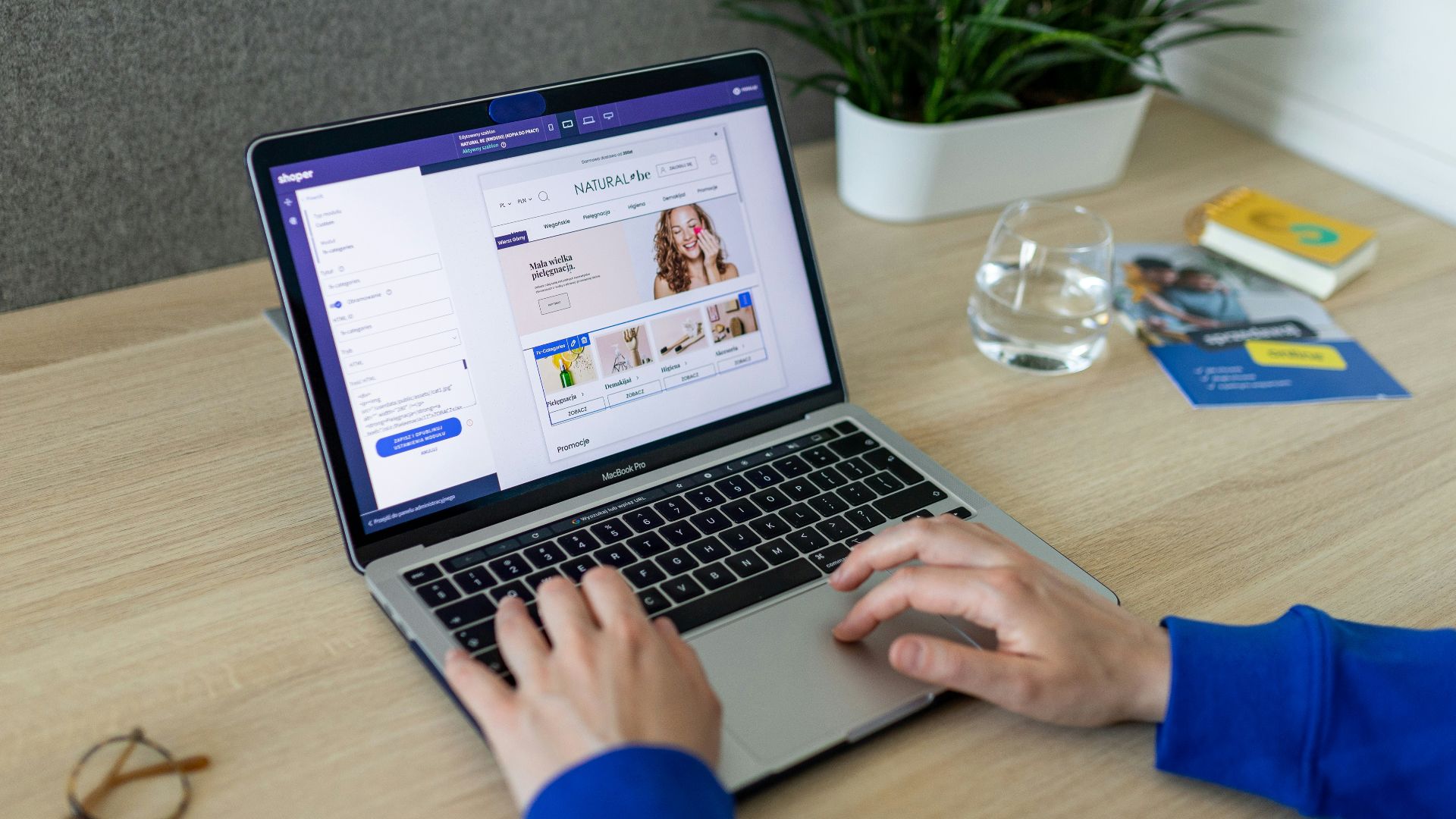 a person typing on a laptop on a table