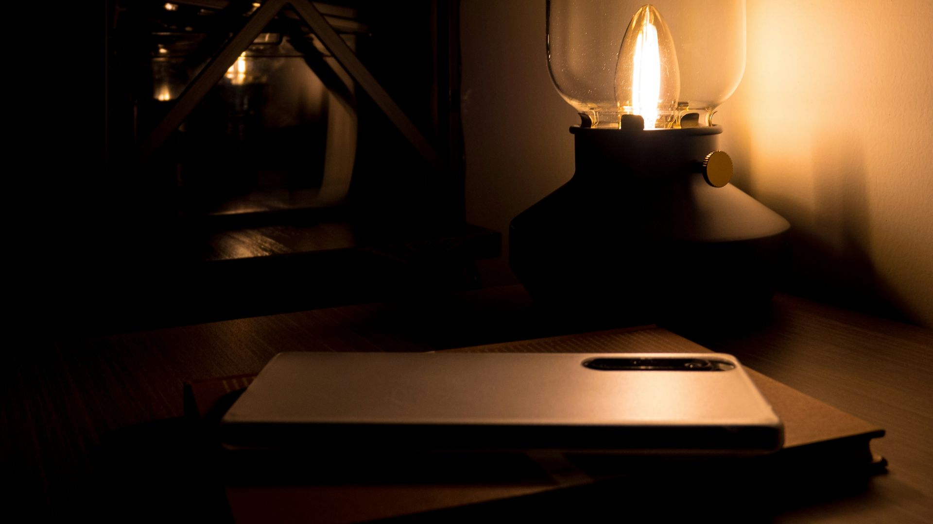 A laptop computer sitting on top of a wooden desk