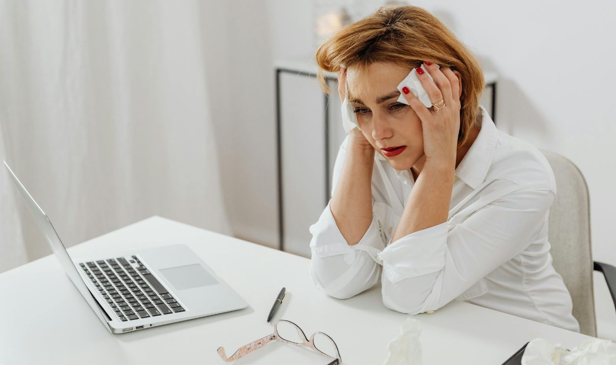 Worried lady at a table
