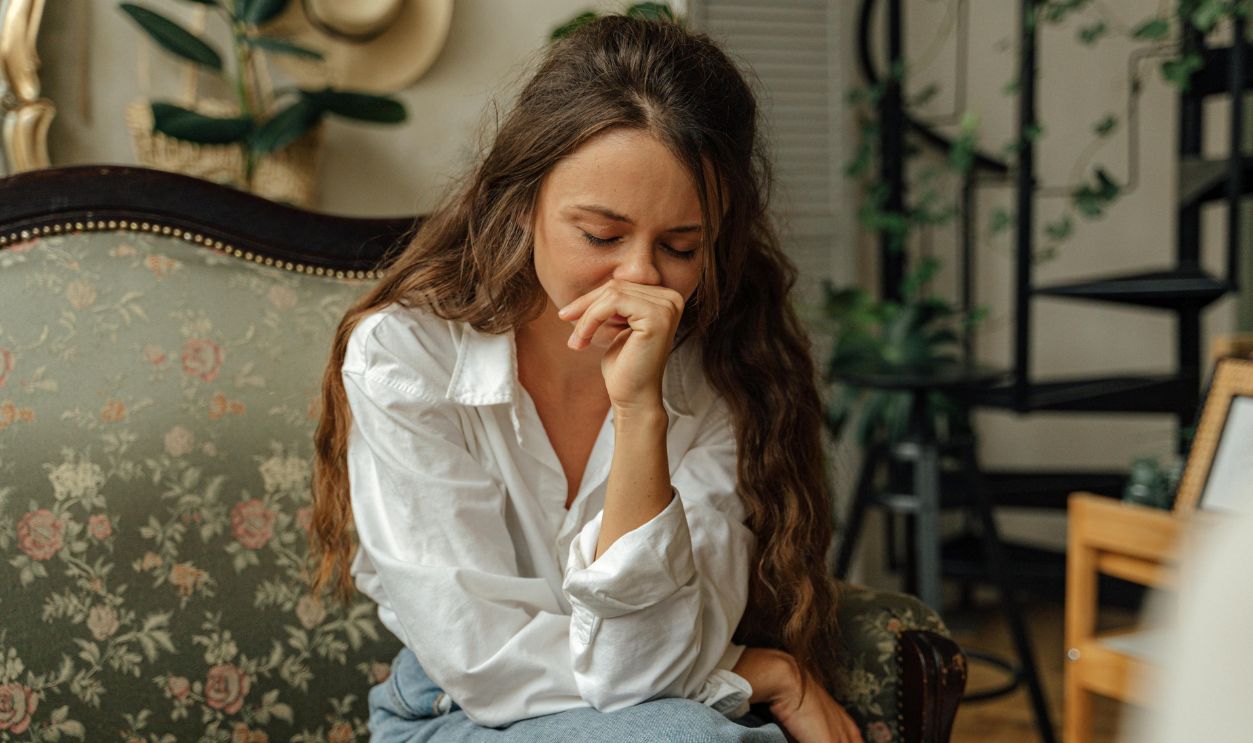 Woman in white dress shirt and blue denim