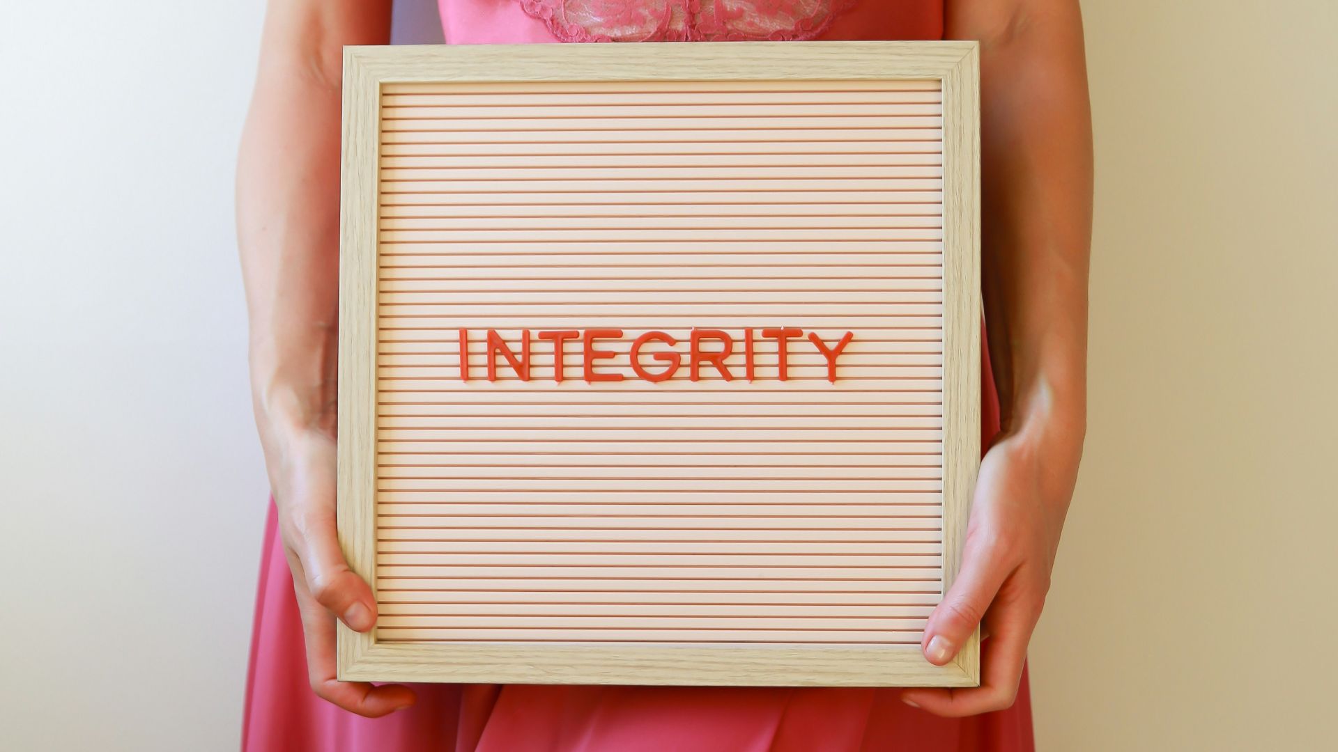 Woman holds a sign that says