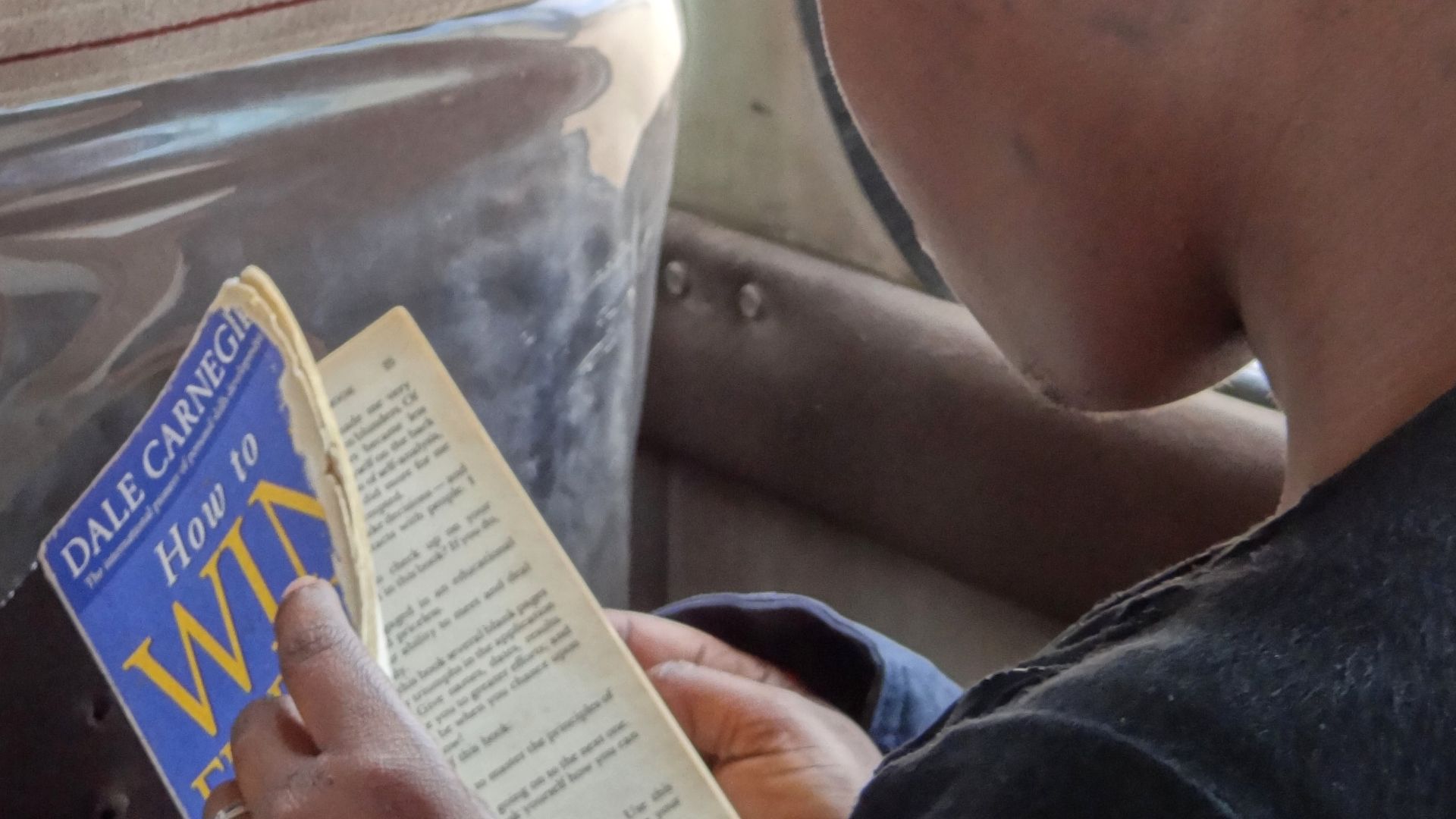 File:Young African Woman Reads Dale Carnegie - How to Win Friends and Influence People - En route from Bagamoyo to Mwenge - Tanzania (8804130591).jpg
