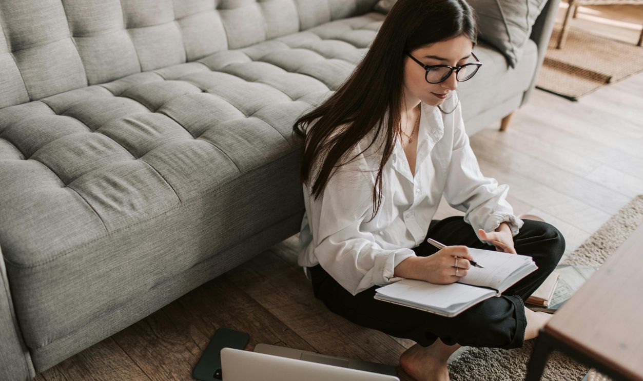 Woman writing in a notebook