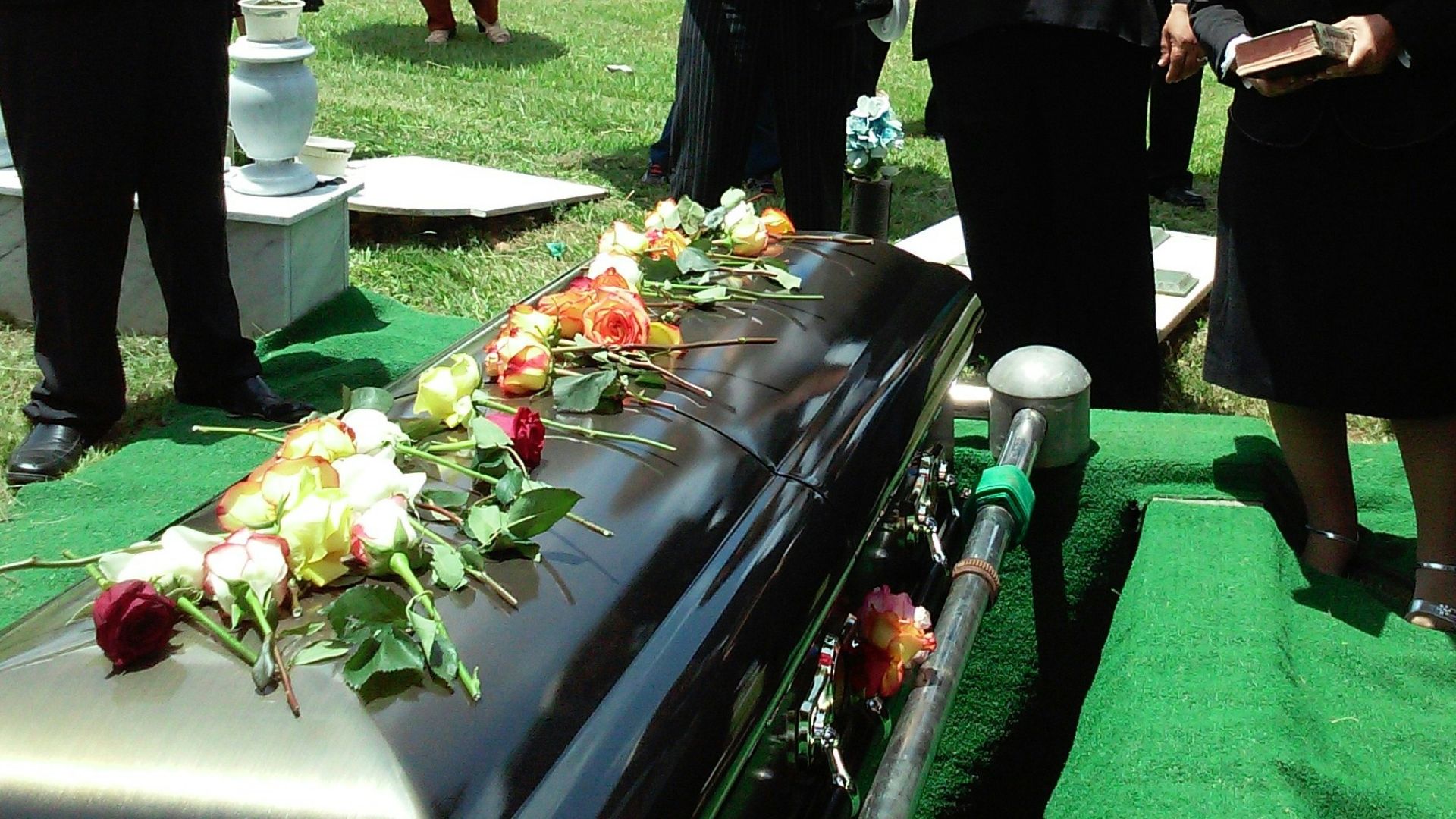 group of people attending burial
