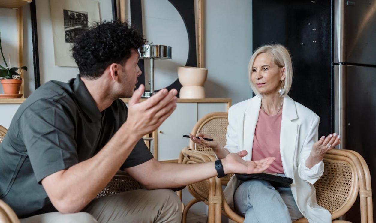 /woman-and-man-discussing
