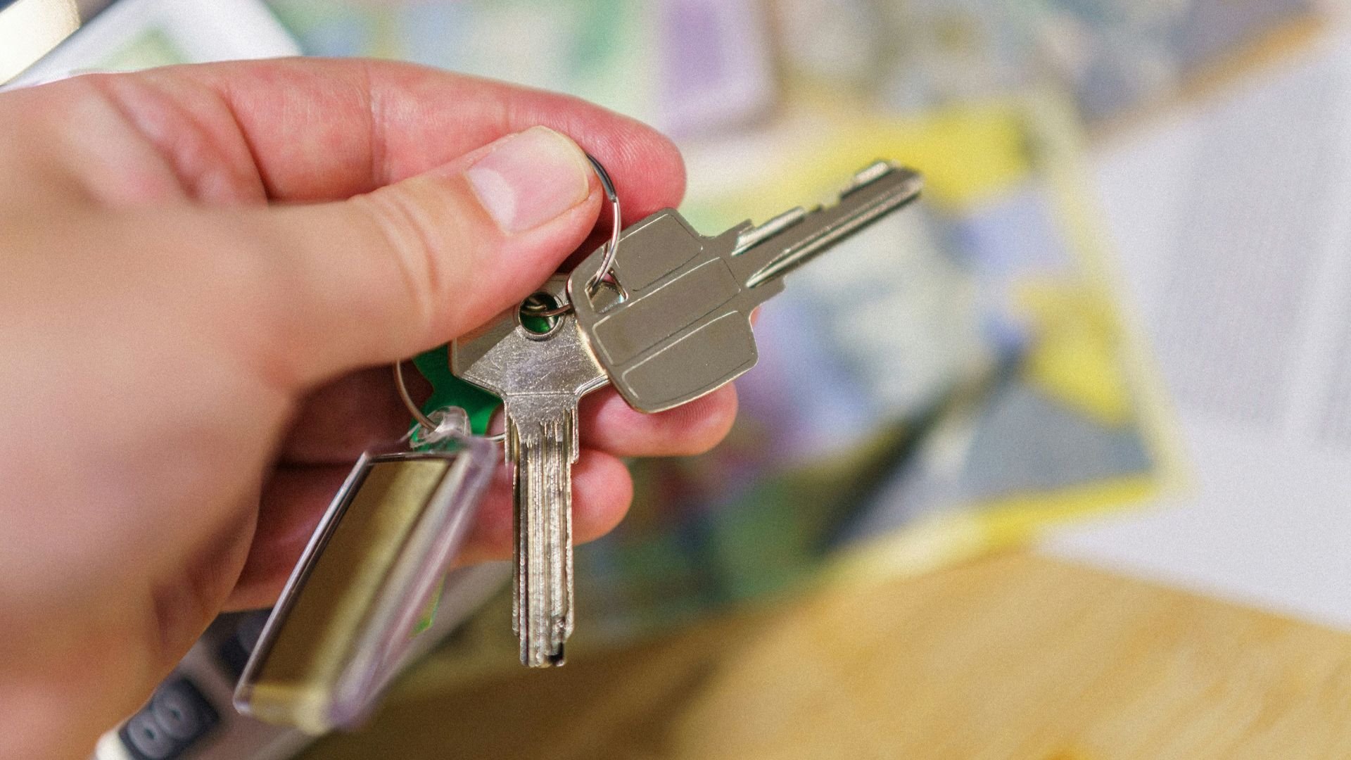 A person holding a bunch of keys in their hand