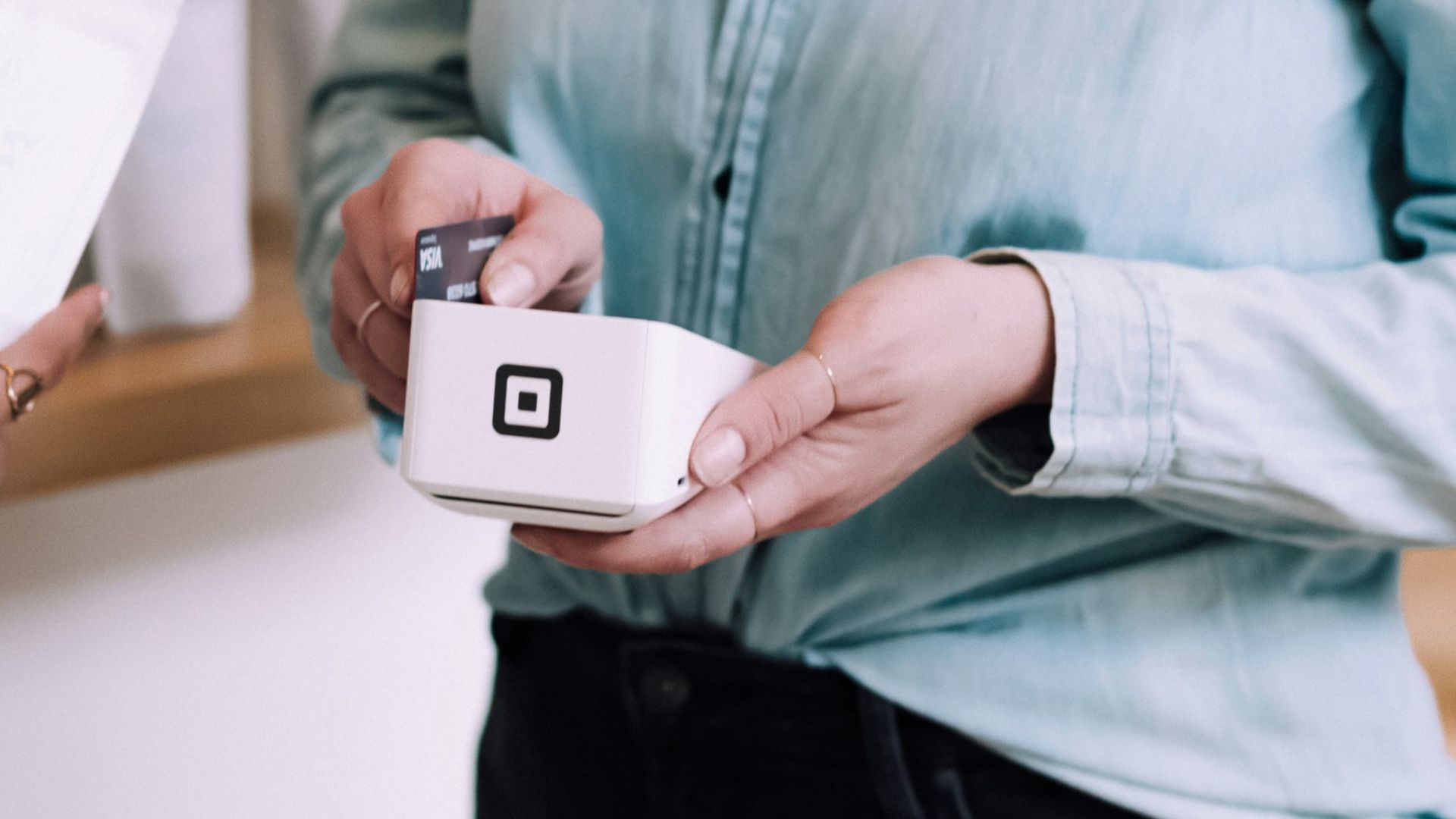 woman holding white pack