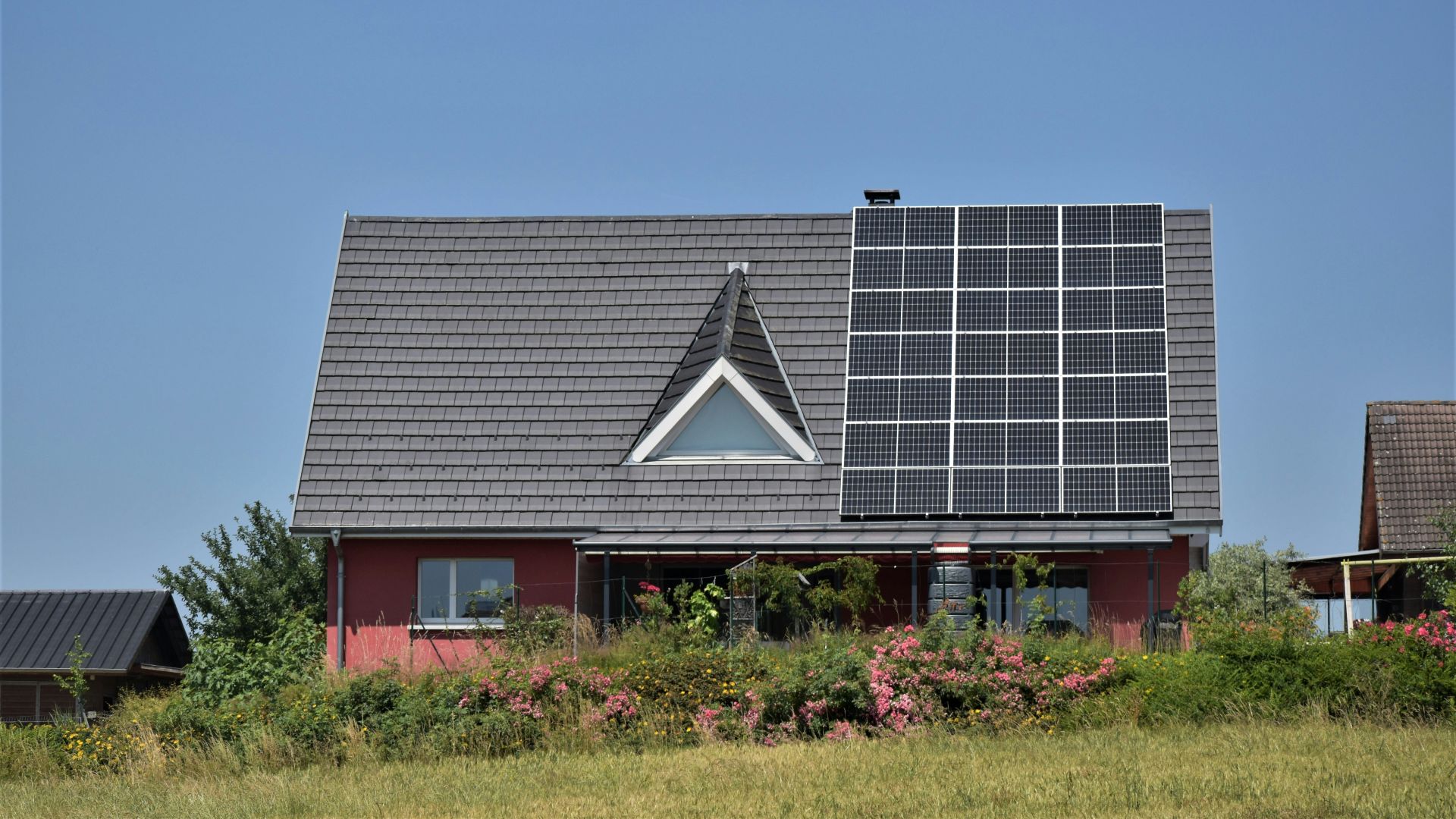 a house with a solar panel on the roof
