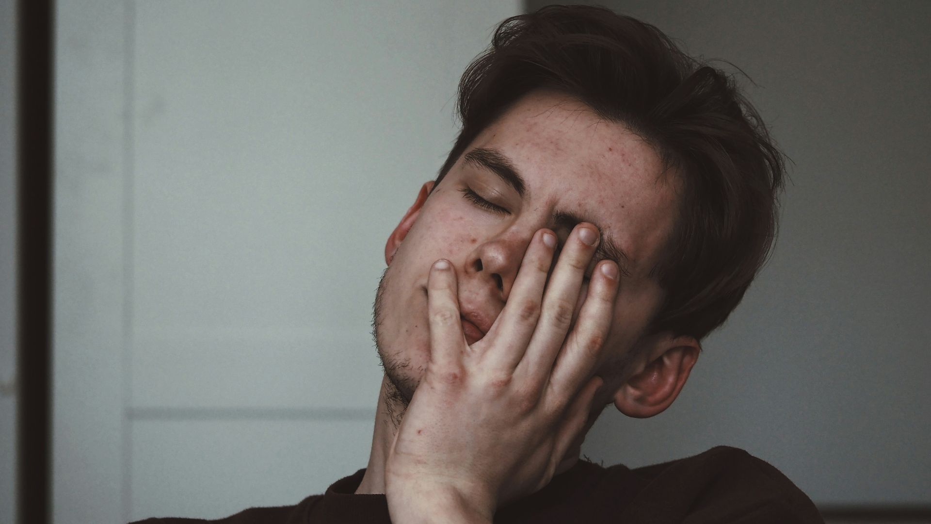 man wearing black crew-neck top