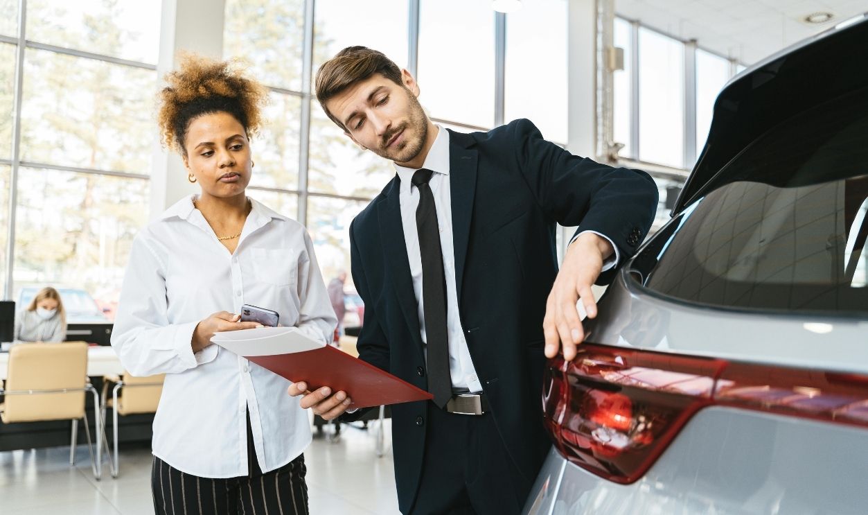 Photo of a Salesman Talking to a Customer