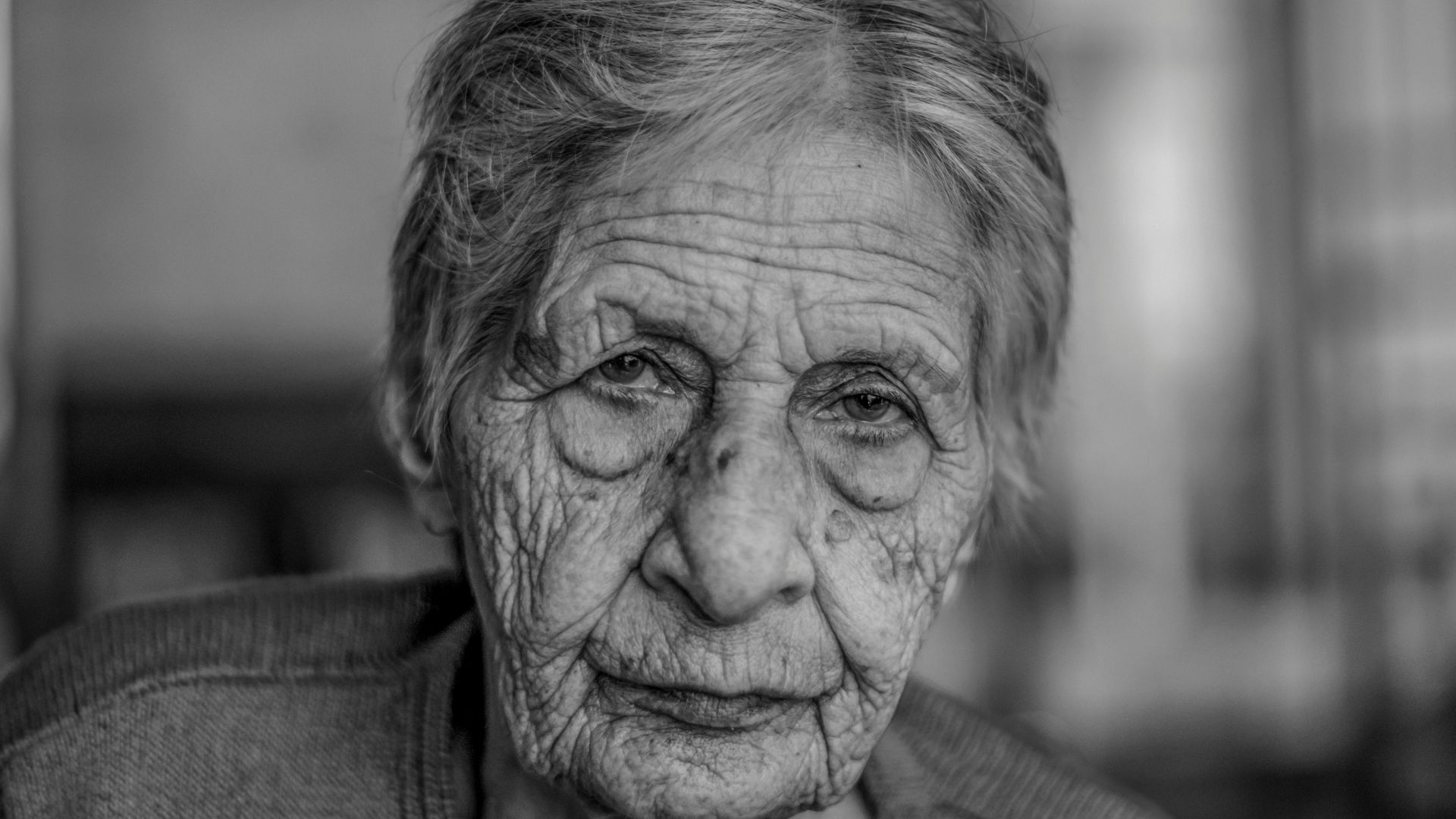old woman in grey shirt