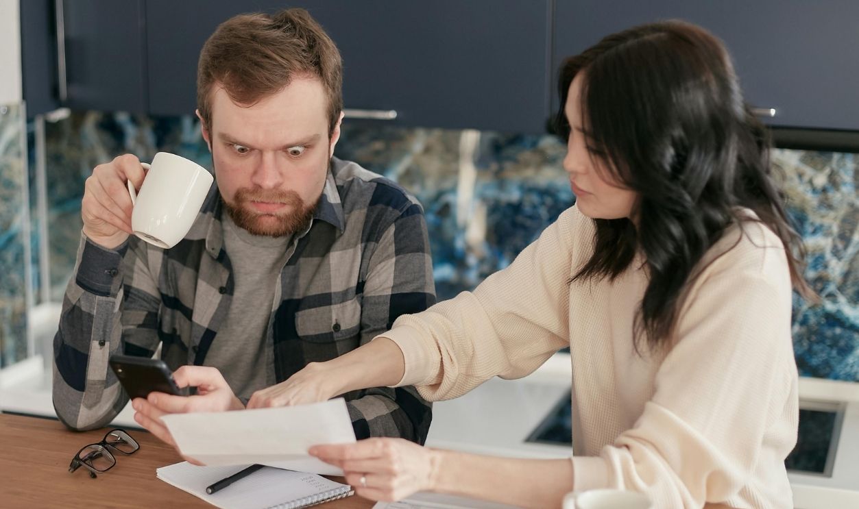 Shocked Man Holding Coffee Mug