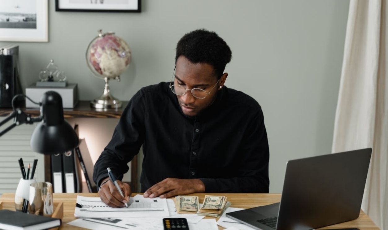 A Man Writing on the Paper