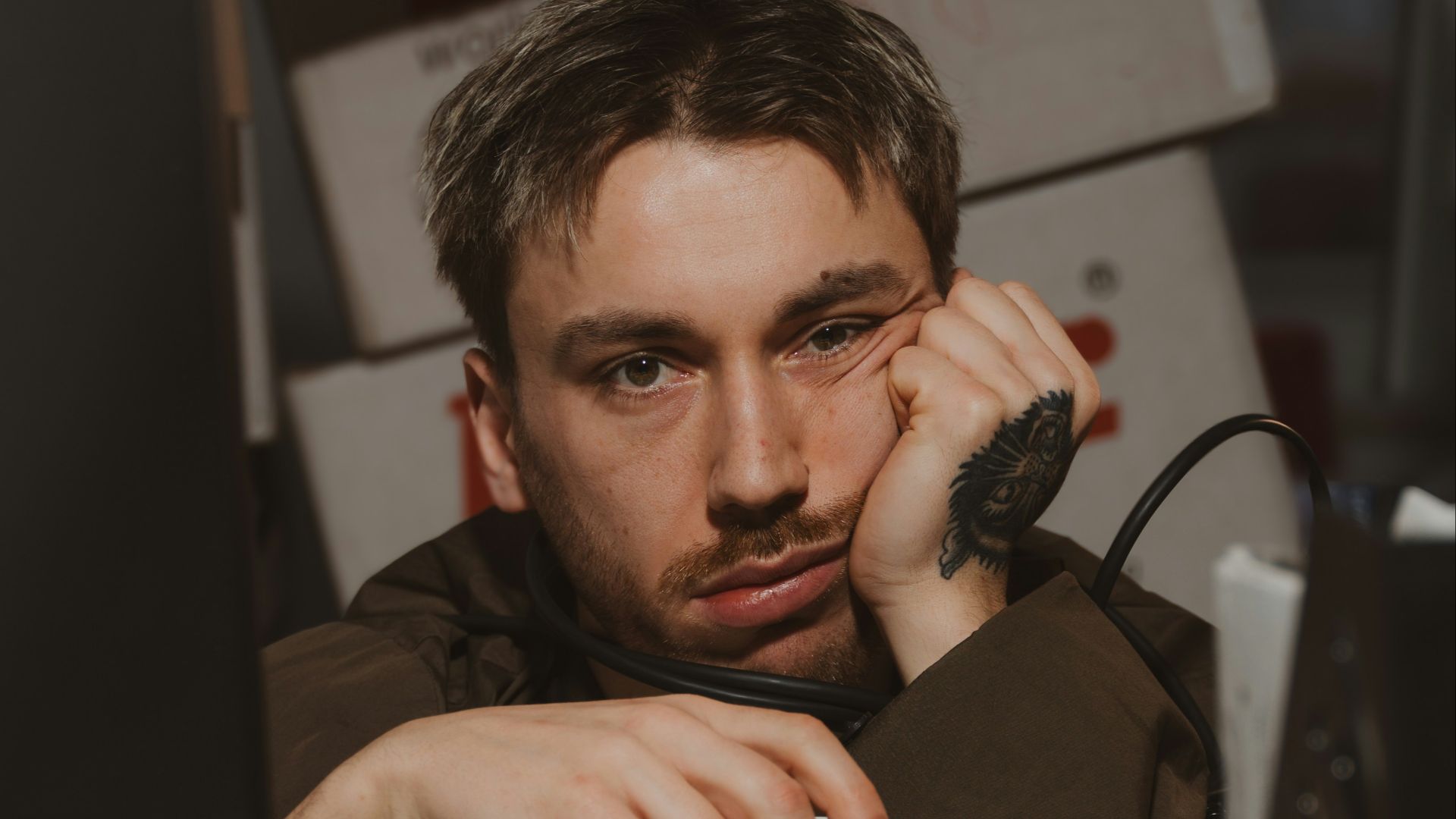 Man is bored and holding a coffee cup.