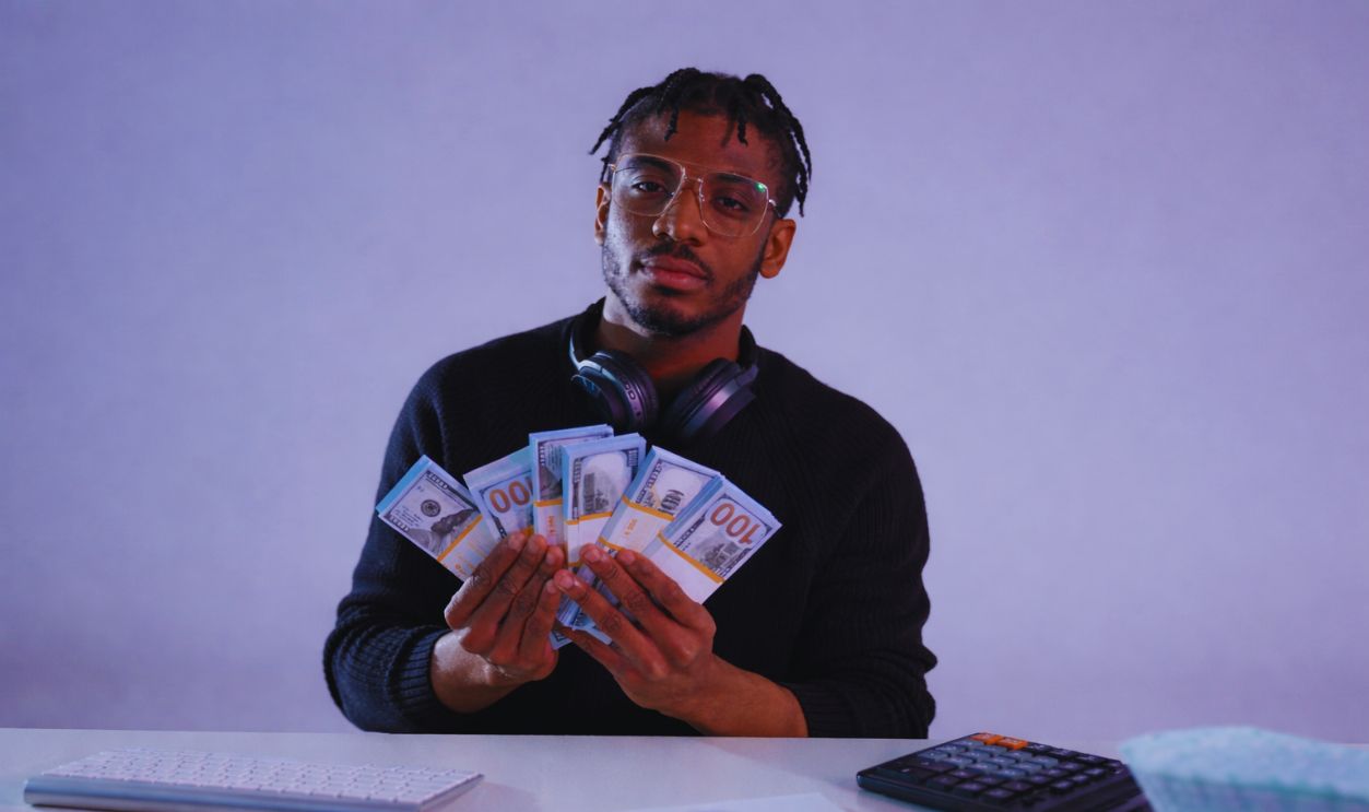 man with 100 dollars