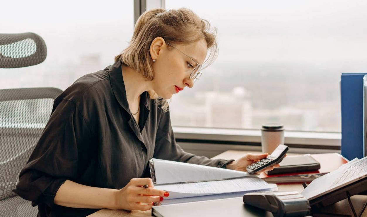 Woman Studying Bank Statements