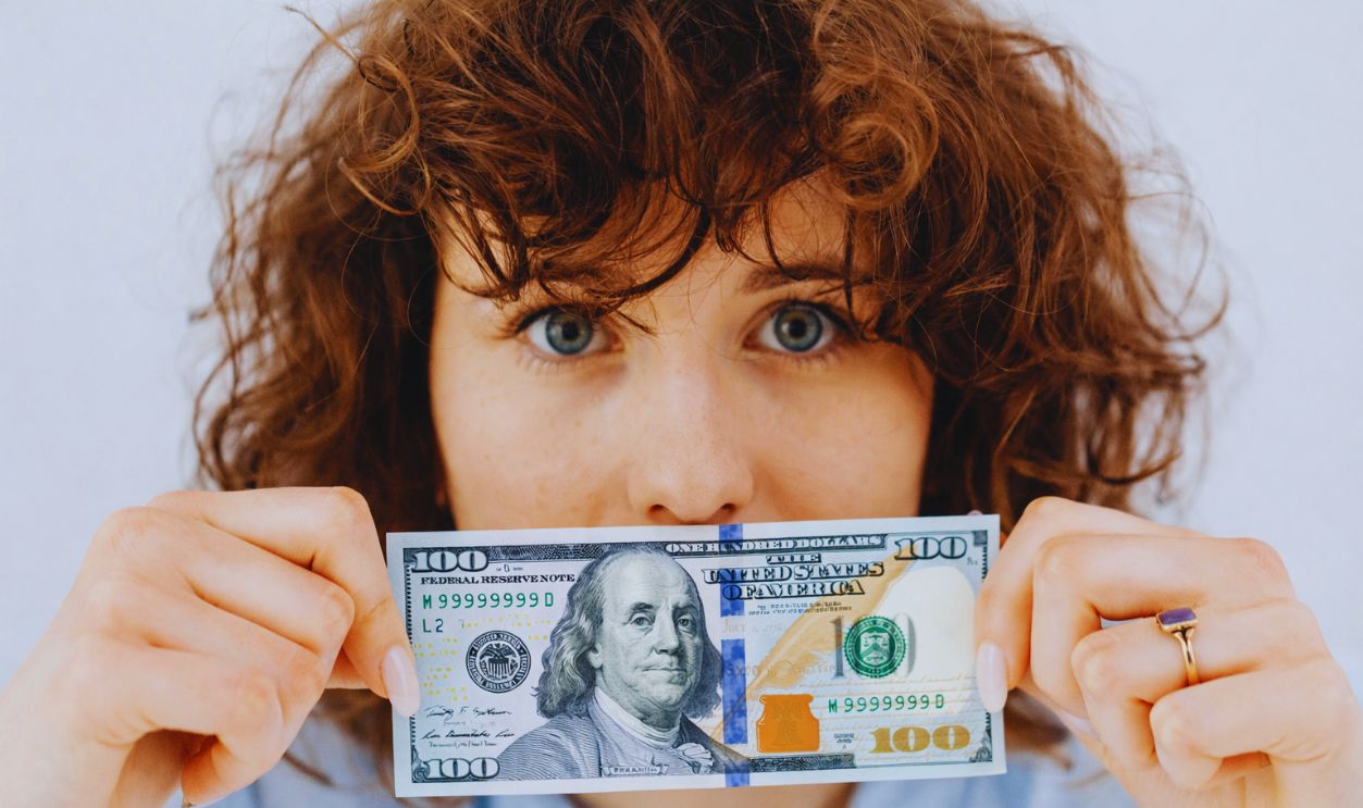 Woman with 100 Dollars