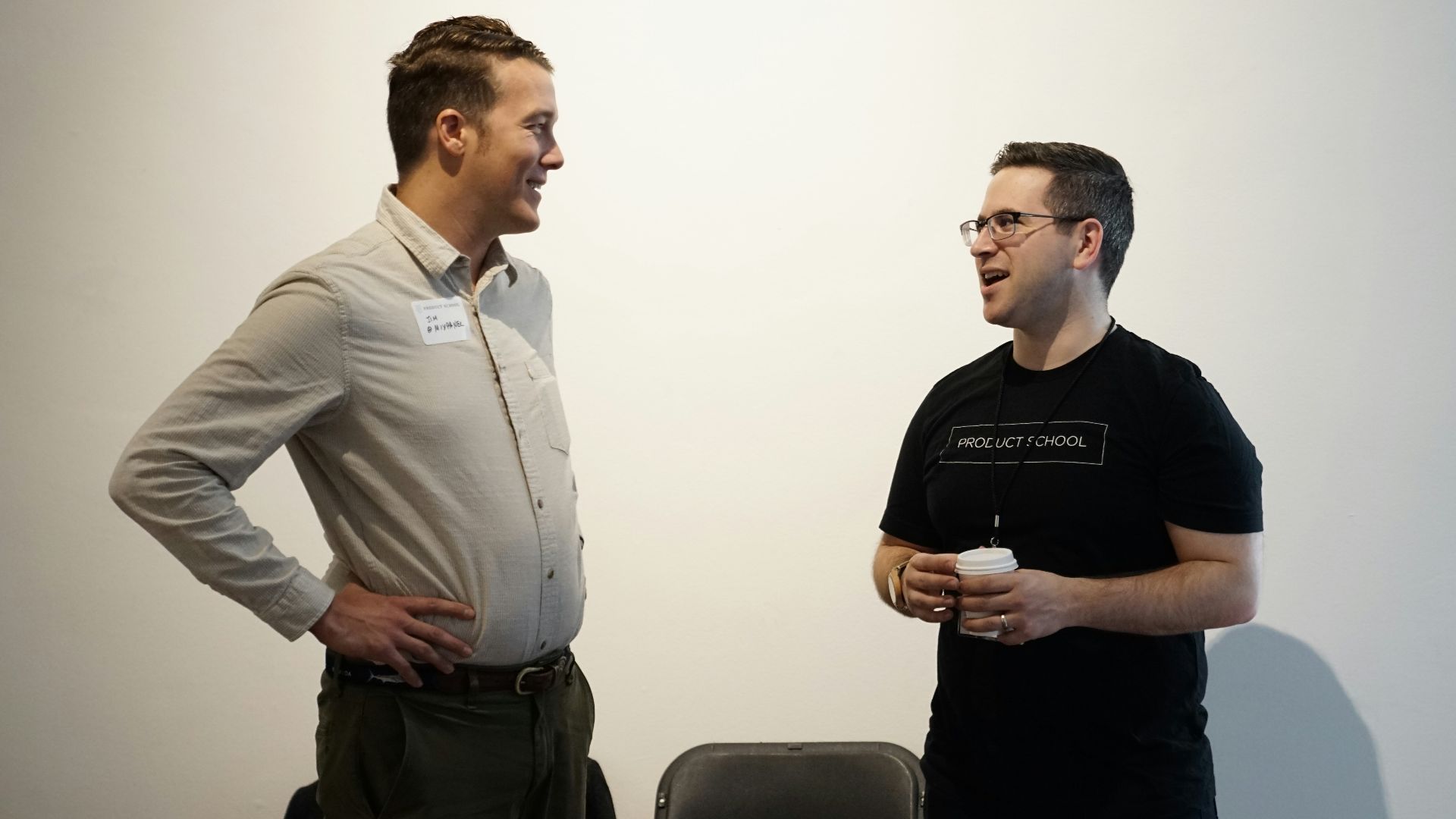 folding chair between two men