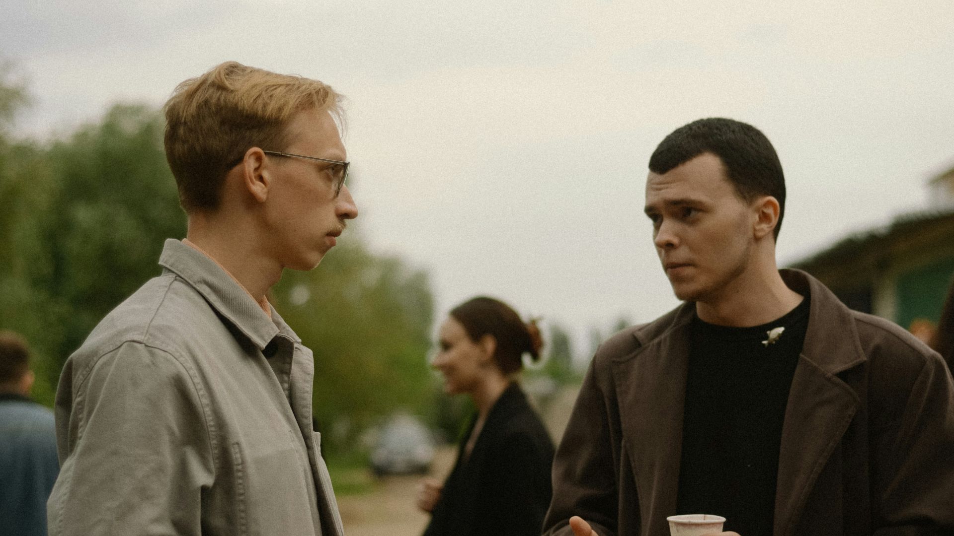 a couple of men standing next to each other