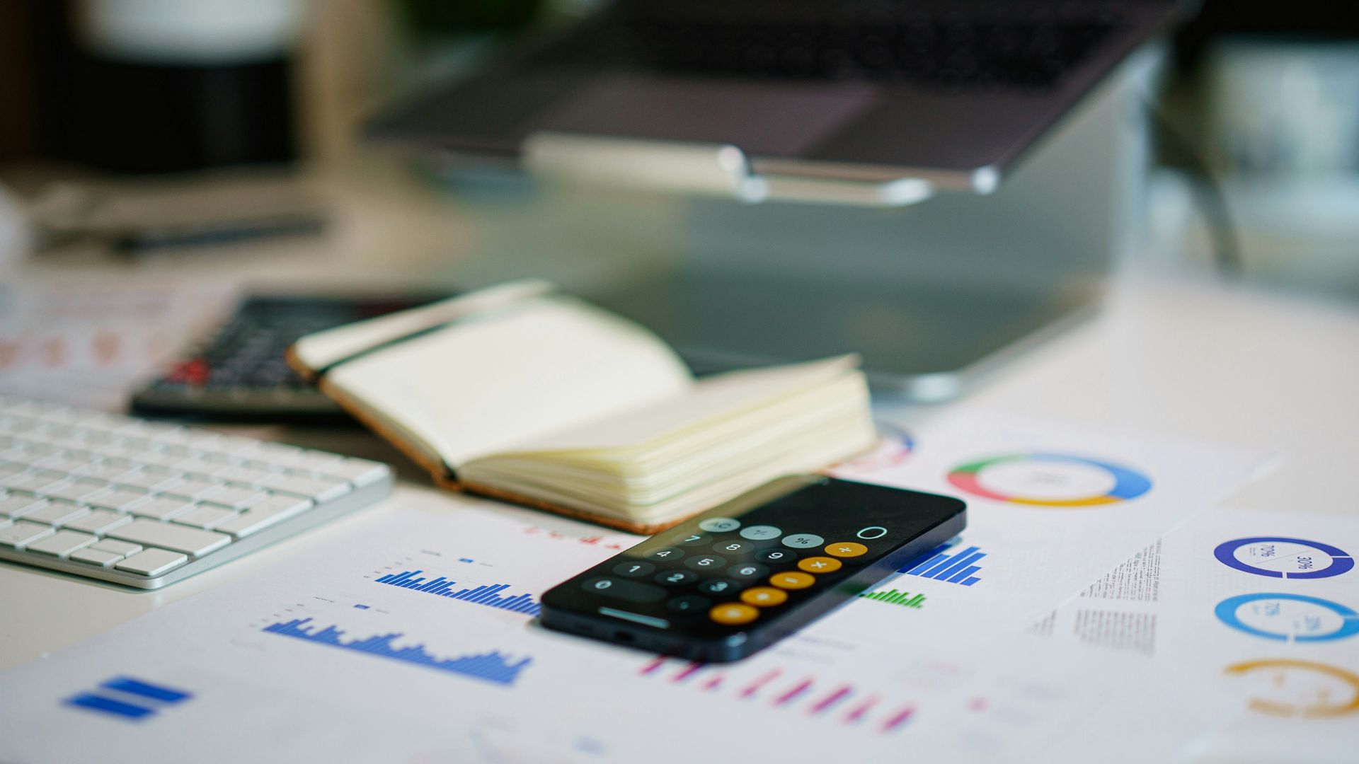 a remote control sitting on top of a table next to a book