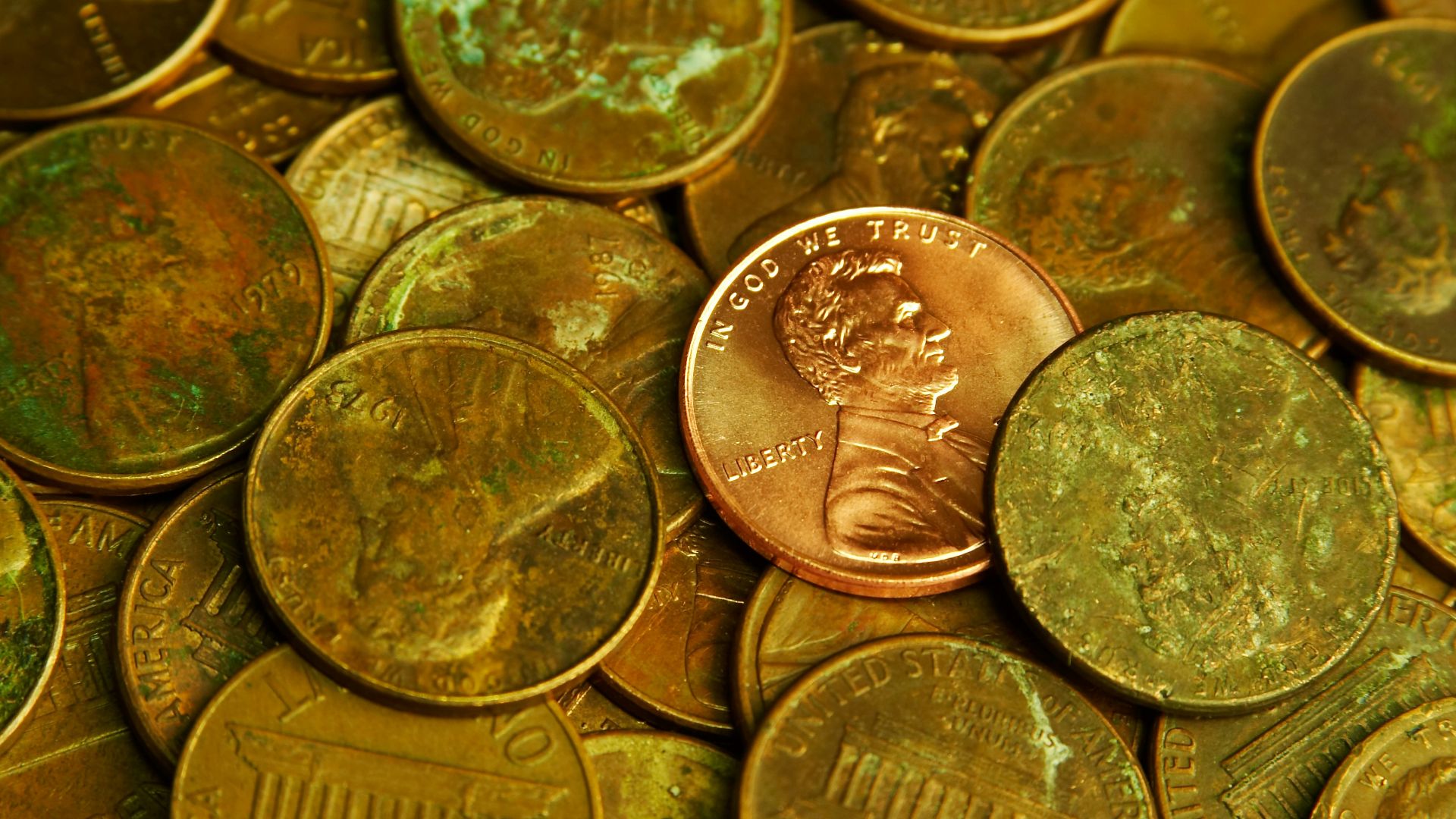Pile of lincoln pennies with one prominent