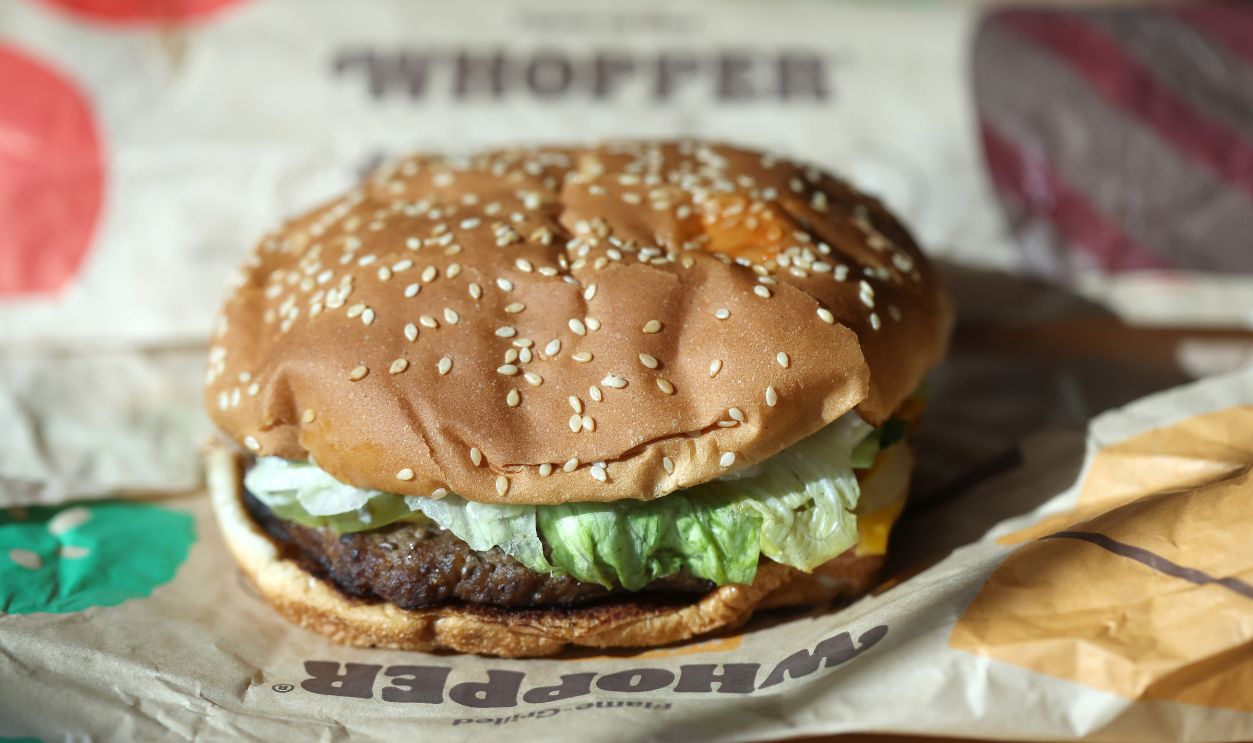 SAN ANSELMO, CALIFORNIA - APRIL 05: In this photo illustration, a Burger King Whopper hamburger is displayed on April 05, 2022 in San Anselmo, California. A federal lawsuit has been filed and is seeking class-action status alleging that fast food burger chain Burger King is misleading customers with imagery that portrays its food, including the Whopper burger, as being much larger than what is actually being served to customers. The lawsuit is being brought by South Florida attorney Anthony Russo.