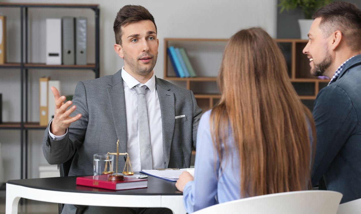 Couple visiting lawyer in office