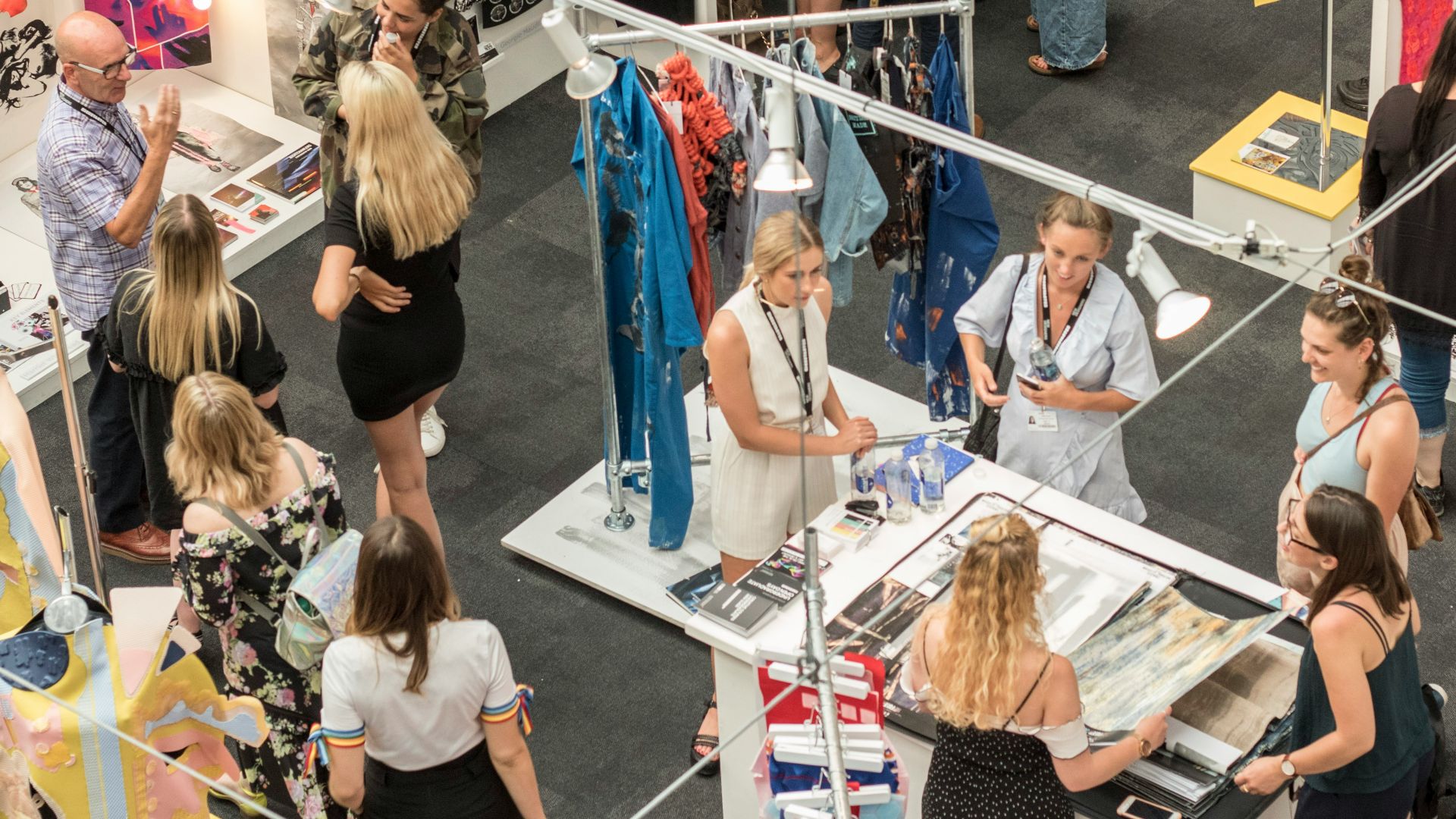 group of people gather in clothes stores