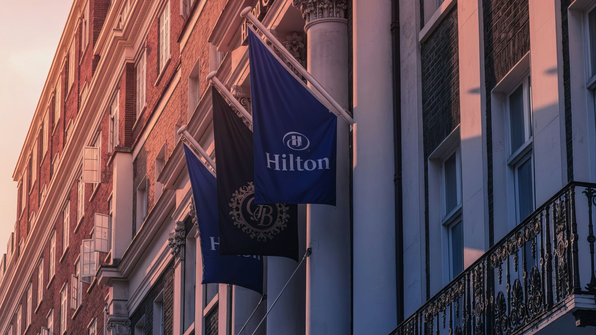 Hilton hotel flags on building exterior