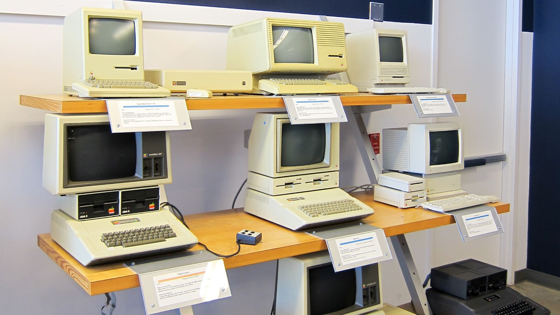 Apple Computer History 1979-1989
top row:

Macintosh 128K (1984)
Apple ProFile (c.1981, 5MB HD for Apple III/II, Lisa)
Apple Lisa 2 (1984)
Macintosh SE/30 (1989)
middle row:

Apple IIplus (1979)
Apple IIe (1983)
Apple IIGS (1986)
bottom row:

Apple IIc (1