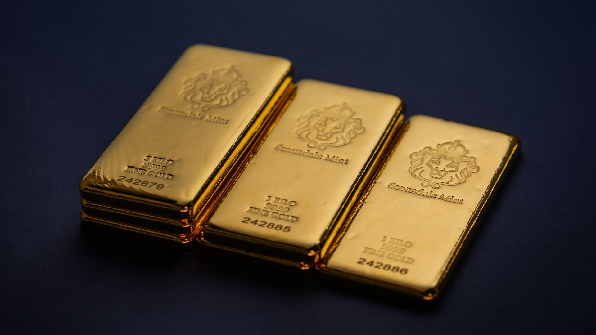 Three gold bars stacked on top of each other