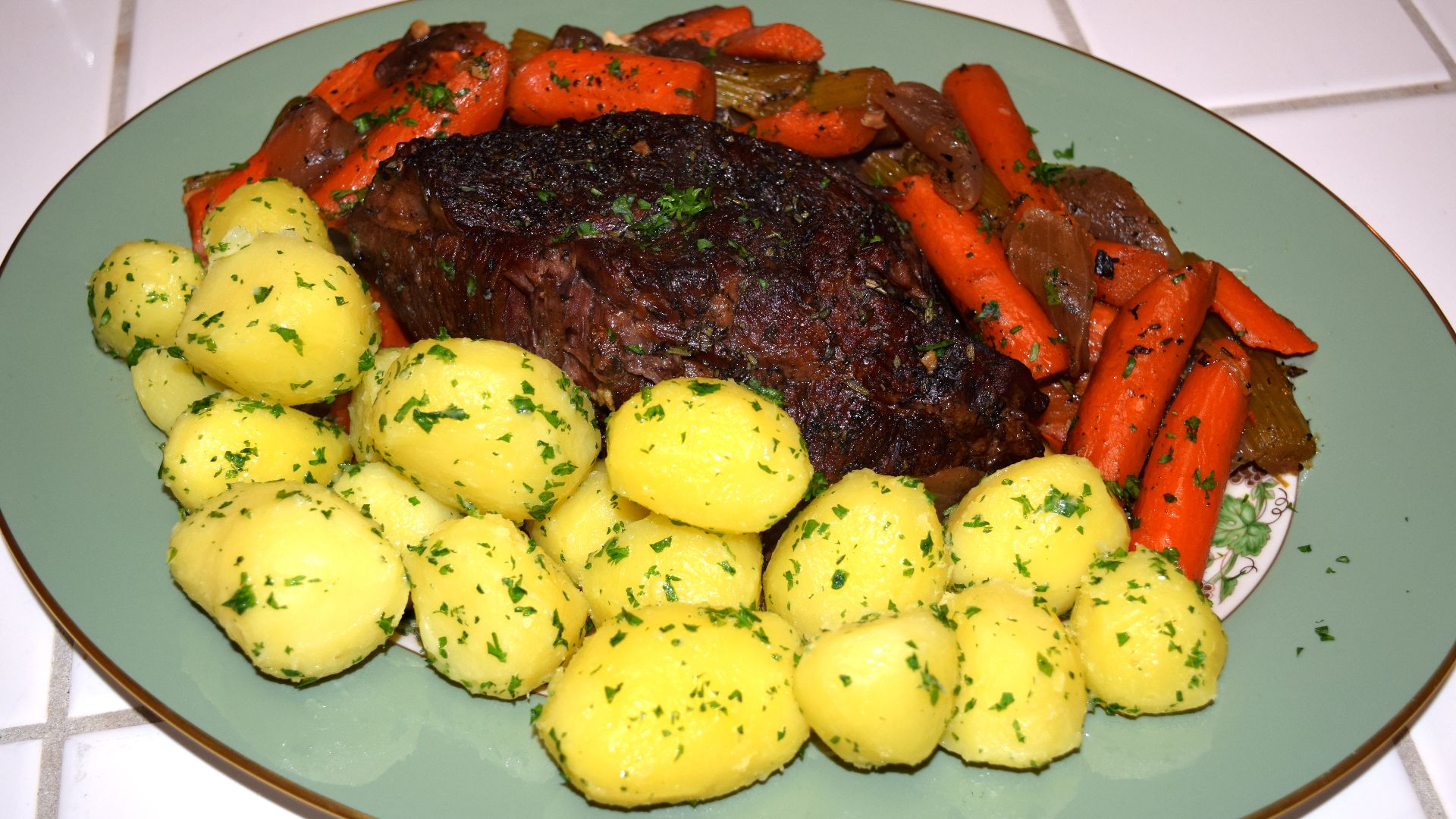American style pot roast served with carrots and parley potatoes.