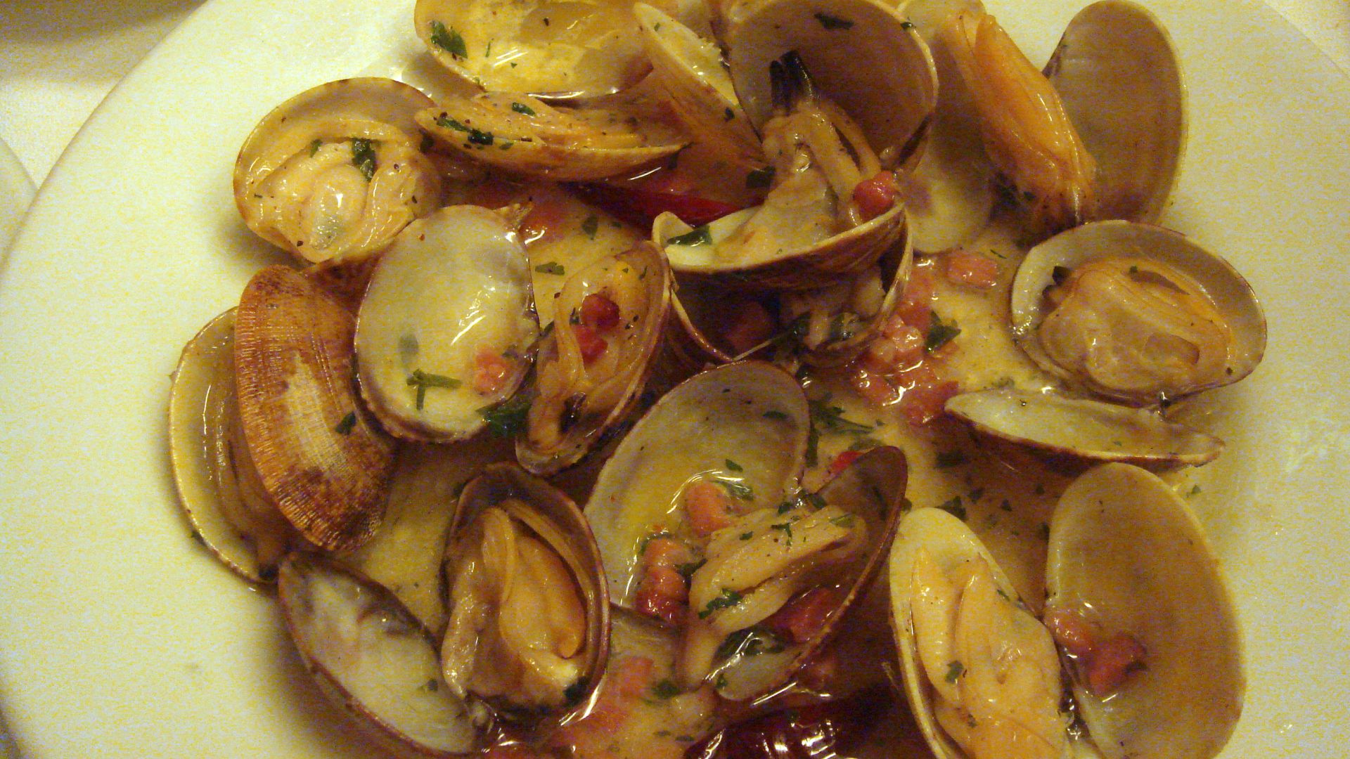 Cooked clams on a plate.