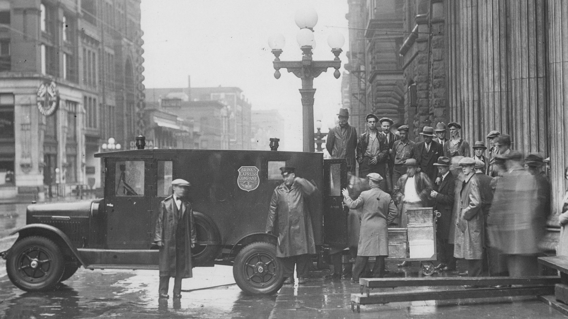 $5,000,000 is transported under heavy guard at 6 a.m. on Sunday morning from the old Northwestern National Bank building. The bank moved to 6th and Marquette.