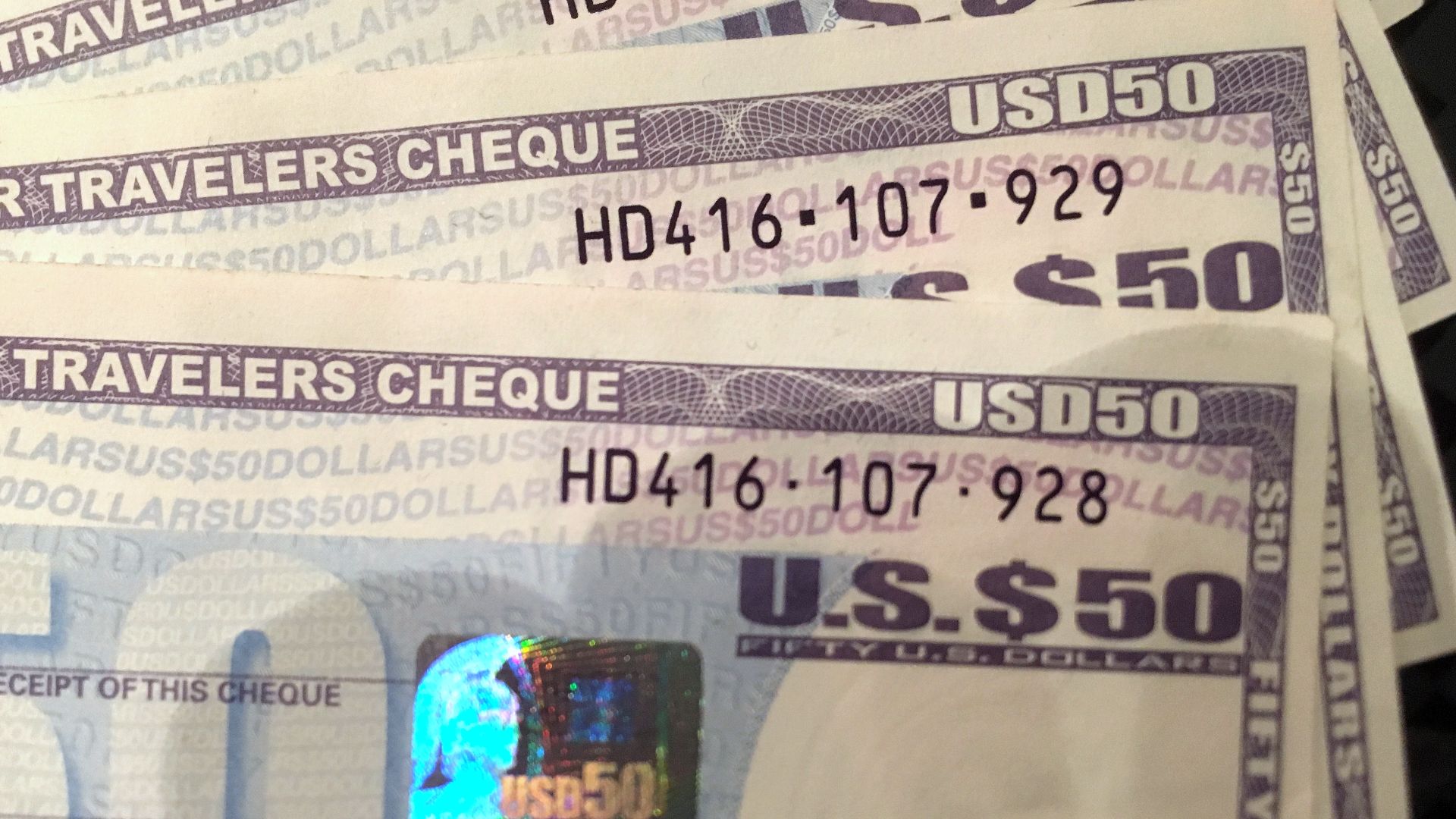 Four Travelers Cheques of 50 USD each, issued by American Express, bought ca. 2012, have long been spent. Soon after the photo was taken in 2016, they were changed back to cash.