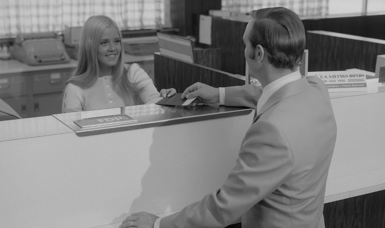 Bank Teller With Customer
