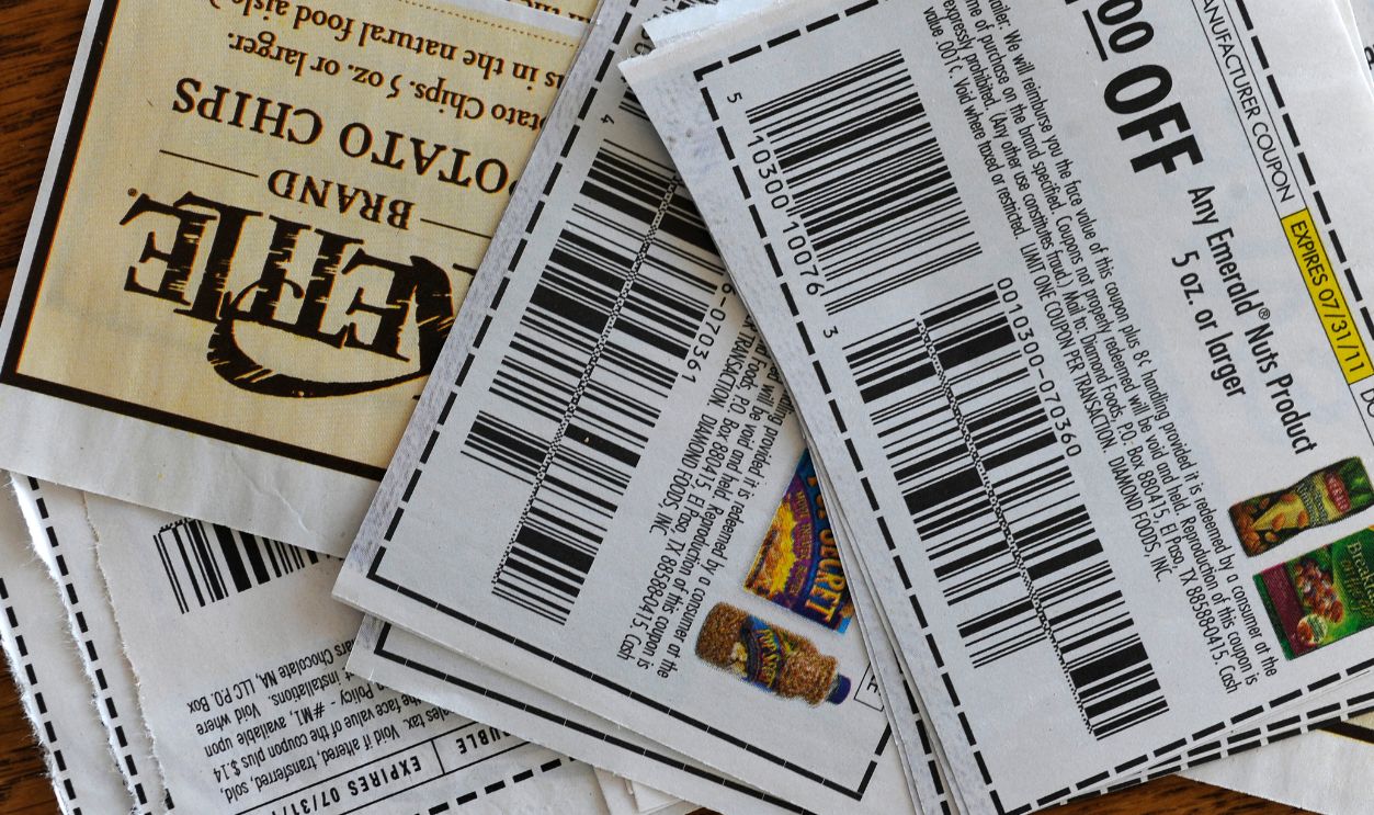 Julie Miller clipped coupons on her kitchen table Thursday afternoon, June 23, 2011. Karl Gehring/ The Denver Post