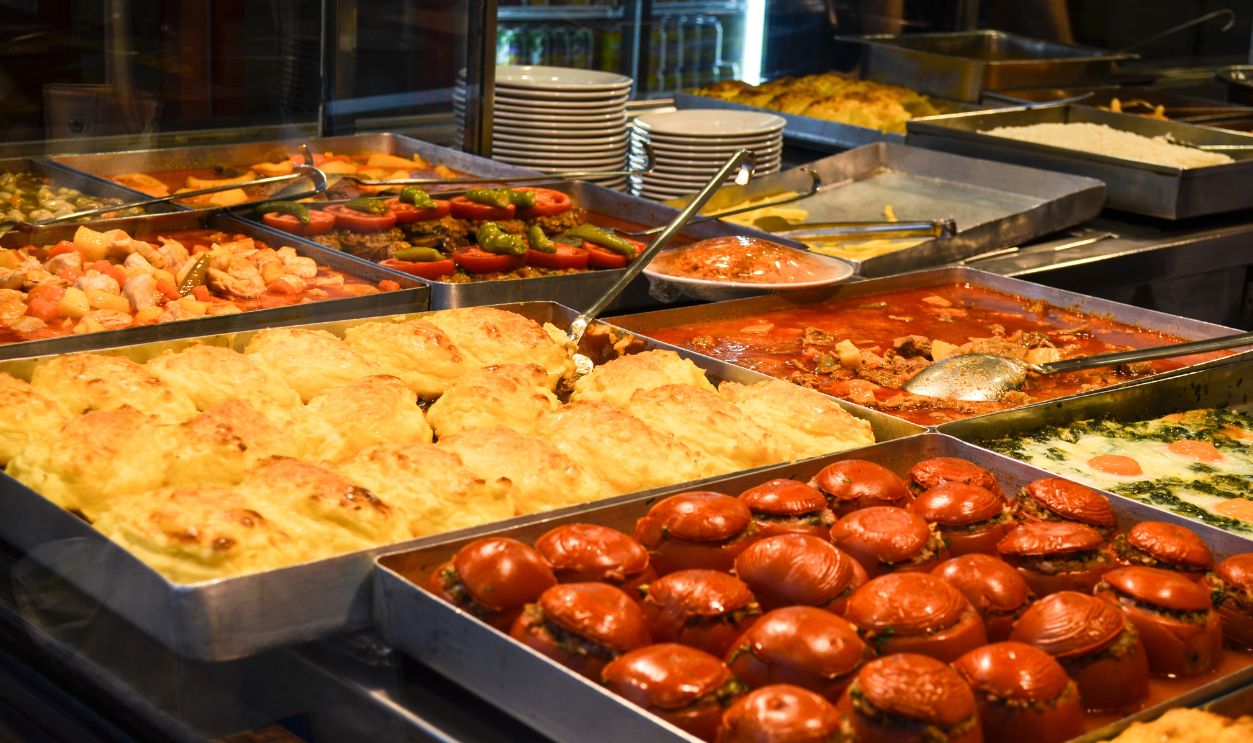very big servings of food fulled with stuffed vegetables and potatoes