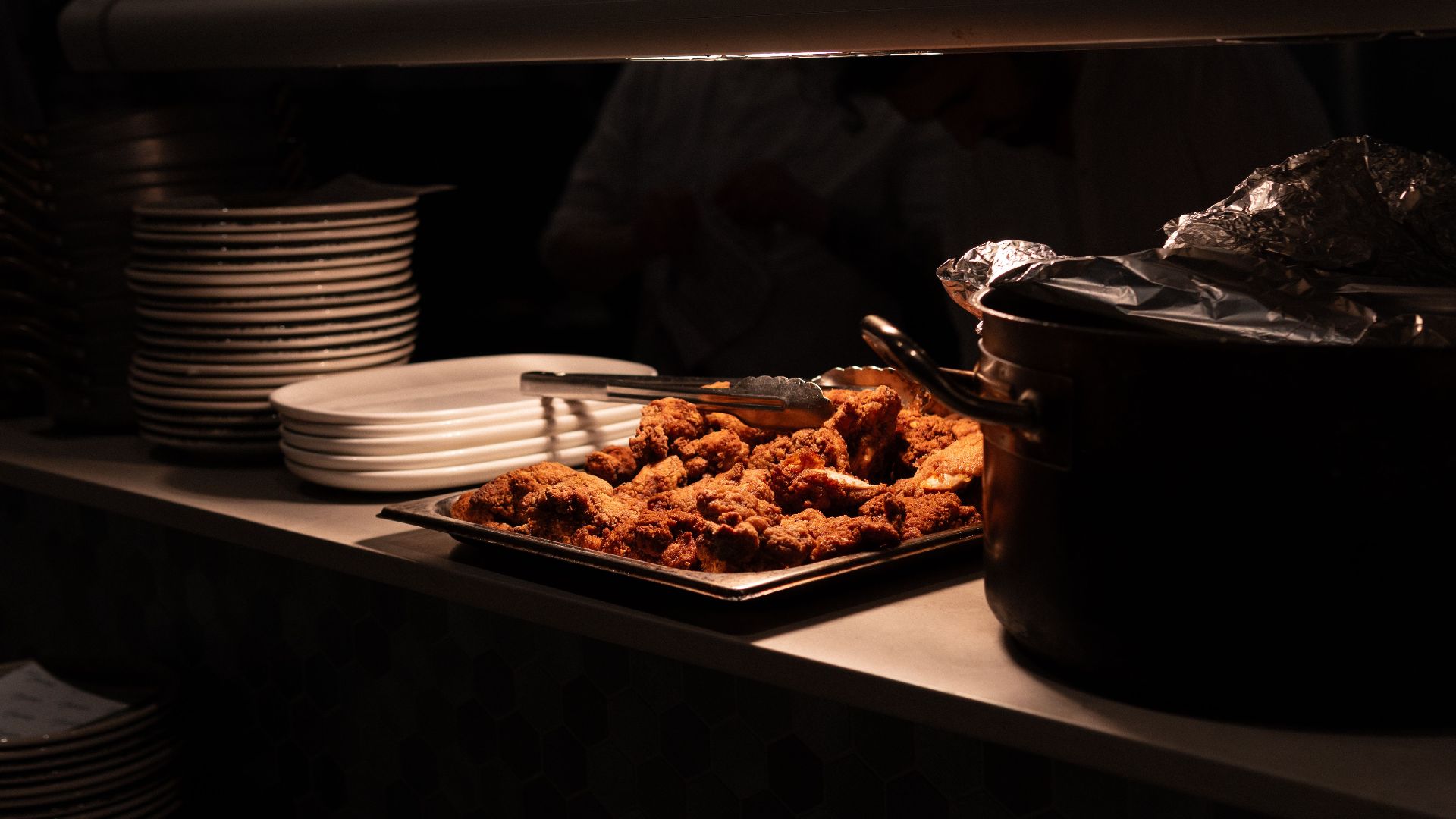 Delicious fried chicken served in restaurant kitchen. Perfect for dining and culinary themes.