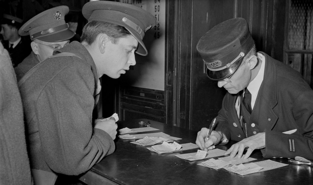 Soldier Checking Train Reservation, Union Station, Chicago, Illinois, USA, by Jack Delano for Office of War Information, January 1943.