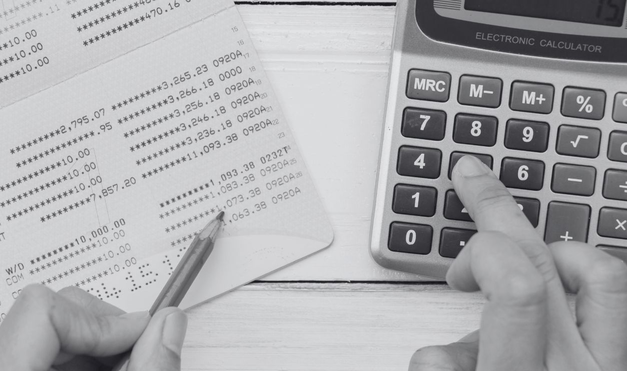 Accountant verify the Saving Account Book and Statement of financial statements / Bookkeeping / Accountancy Concept.