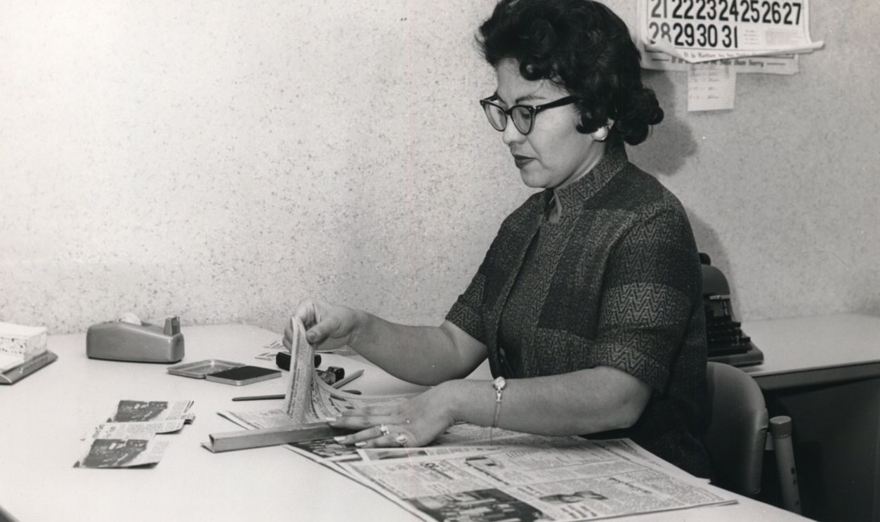 HOUSTON, TEXAS - OCTOBER 11: 10/1962 - Anita Huerta prepares clips to file into clip files in Houston Chronicle Library