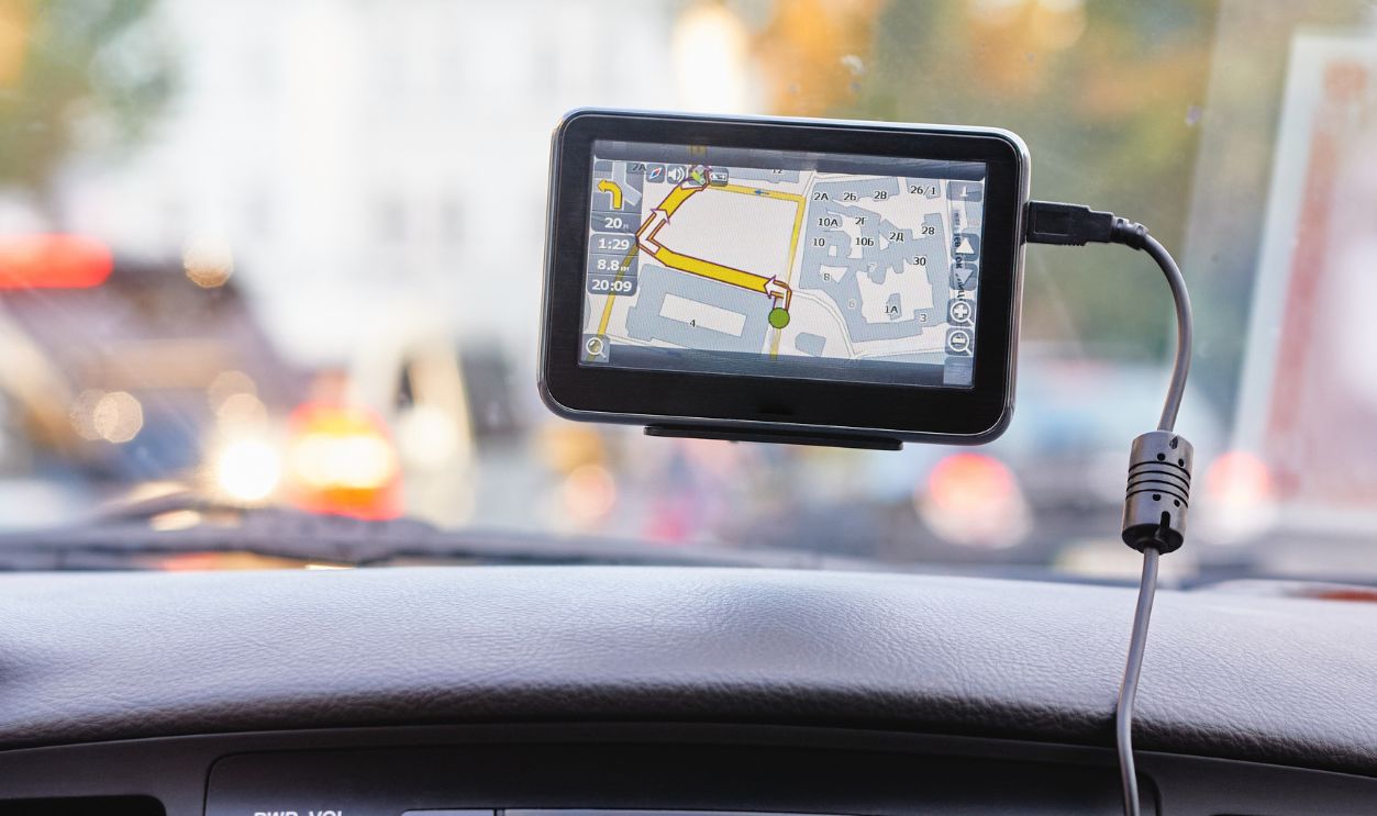 Dashboard with Navigation Device and Audio Player in a Moving Vehicle