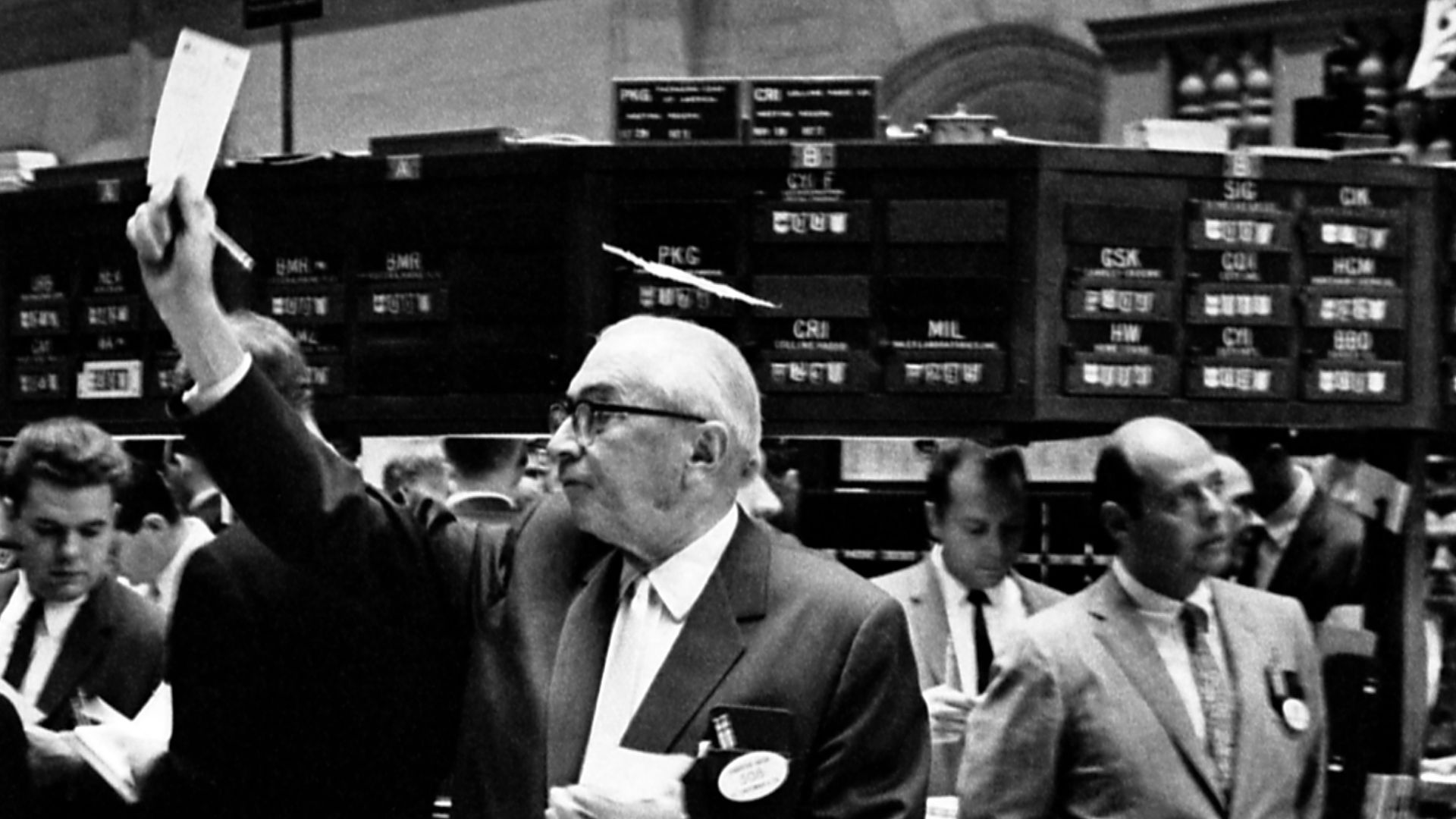 Photograph shows stock brokers working at the New York Stock Exchange