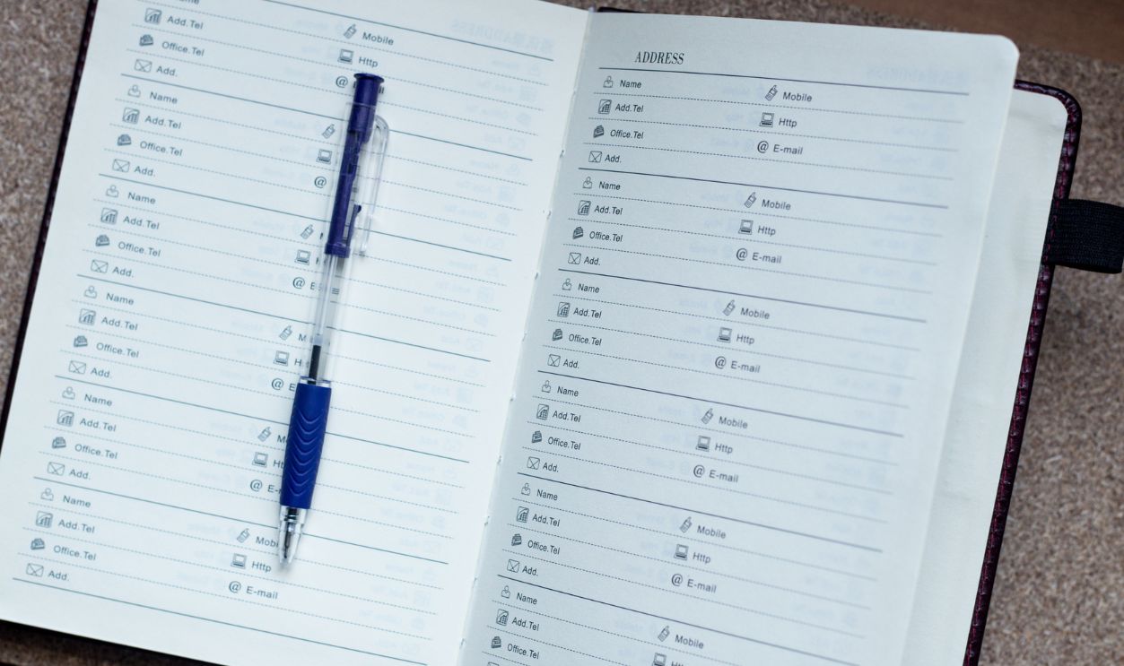 Address book with a pen