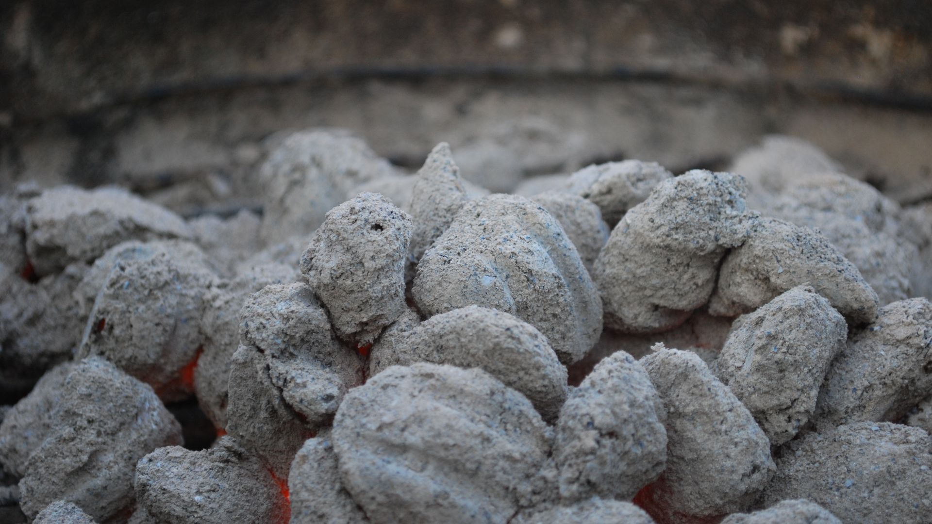 Smoldering charcoal briquettes