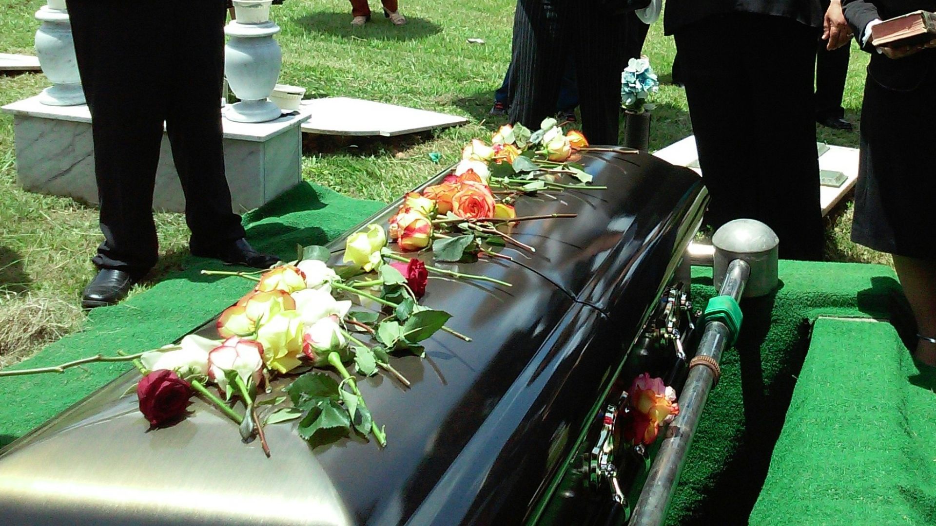 group of people attending burial