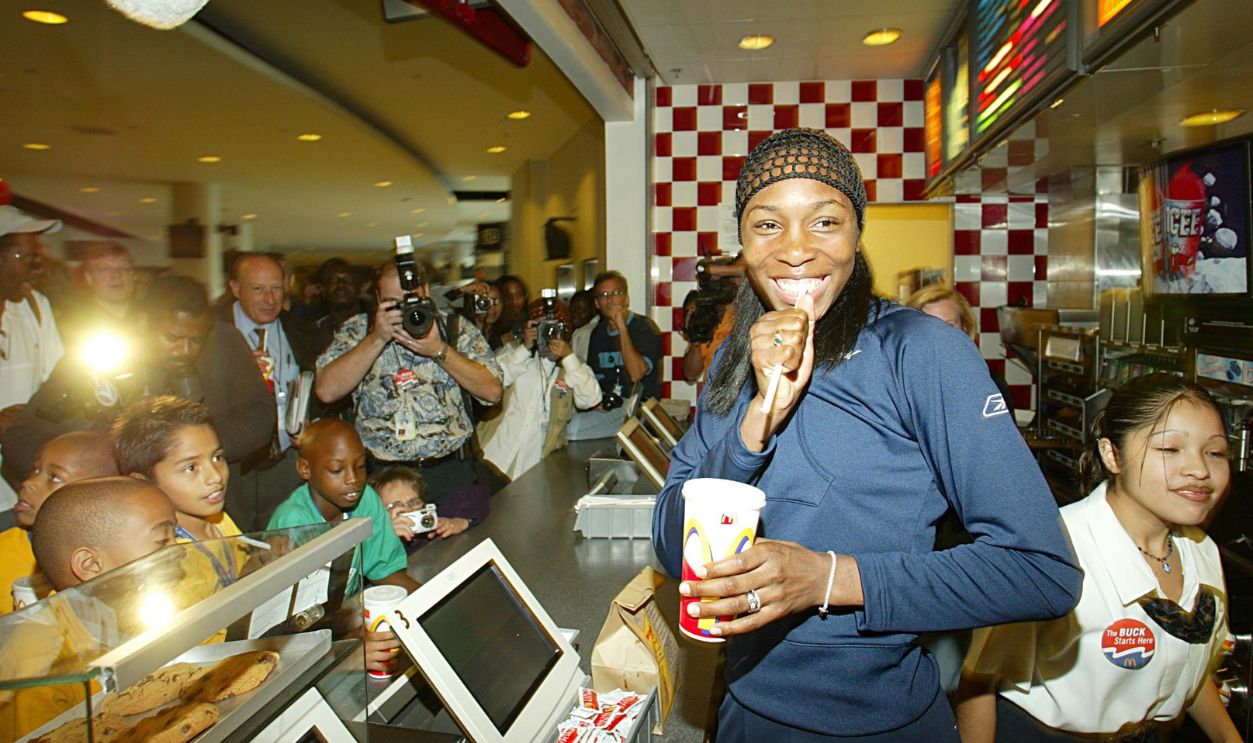 Venus Williams steps behind the counter to serve up McDonald's National Dollar Menu to some of their young fans. The two tennis super sisters recently signed a three-year agreement with the Golden Arches which includes advertising, promotions, and public service. The Williams Sisters will star in an upcoming McDonald's Dollar Menu television commercial with the Hamburglar