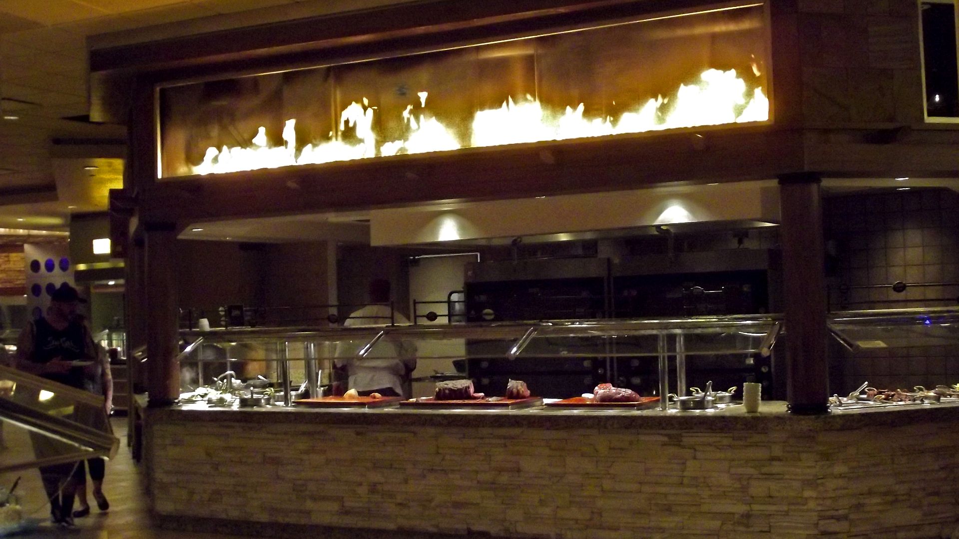 A gas fire is displayed for effect above the carving station at the Carnival World Buffet, The Rio, Las Vegas, Nevada