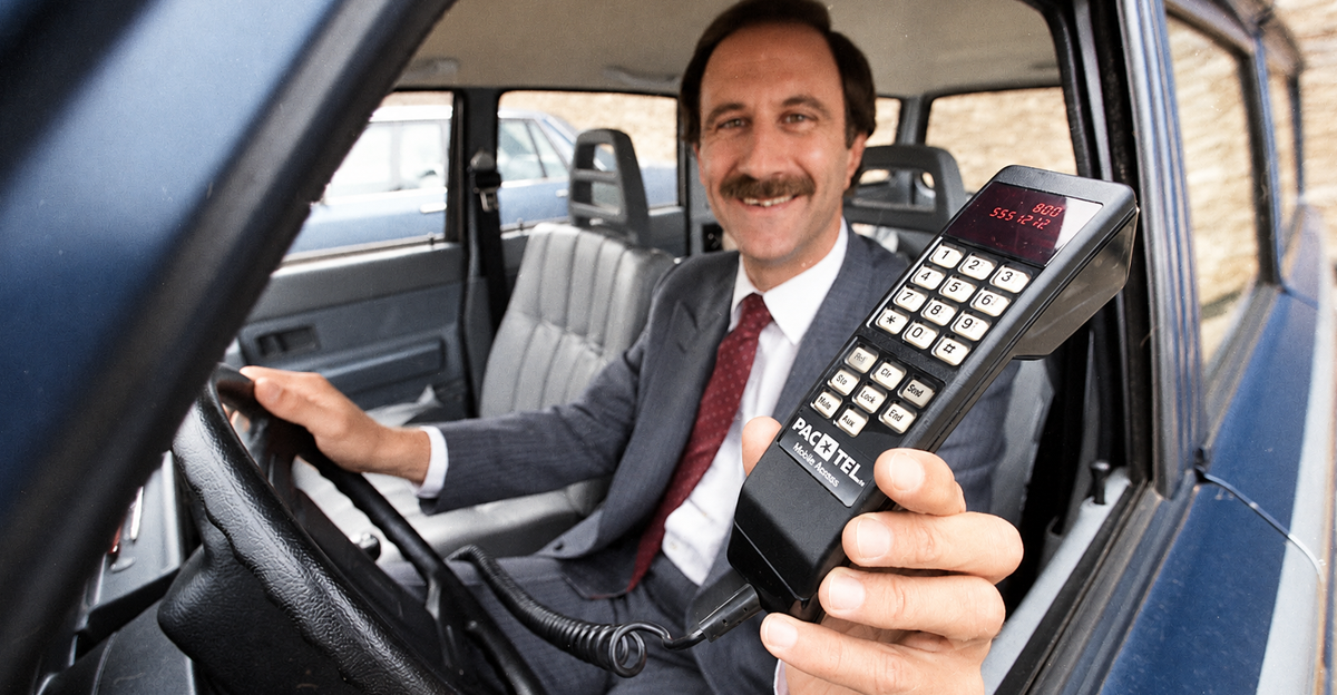 Nov. 14, 1984: Al Feinman with PacTel Mobile Services displays a new cellular phone.